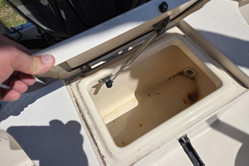 Open storage compartment on 2007 Grady-White Tournament 205 boat.