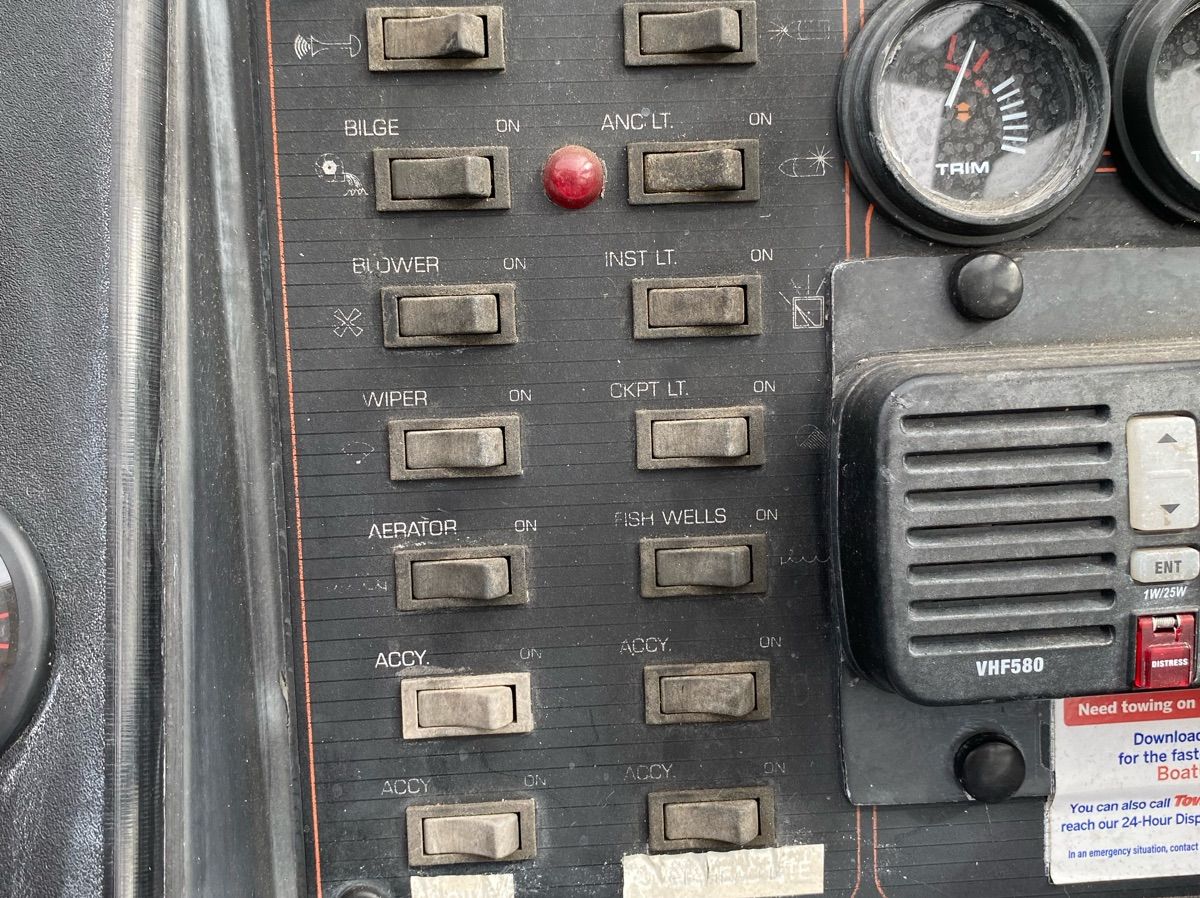Dashboard of a 1990 Bayliner 2302 Trophy boat.