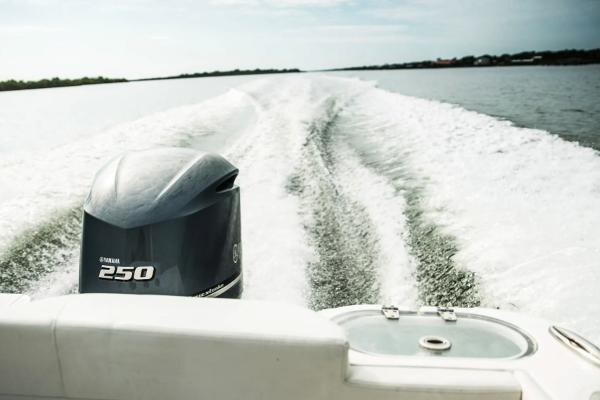 Manufacturer Provided Image: 2023 Edgewater 230CX Crossover boat with Yamaha 250 engine cruising on open water.