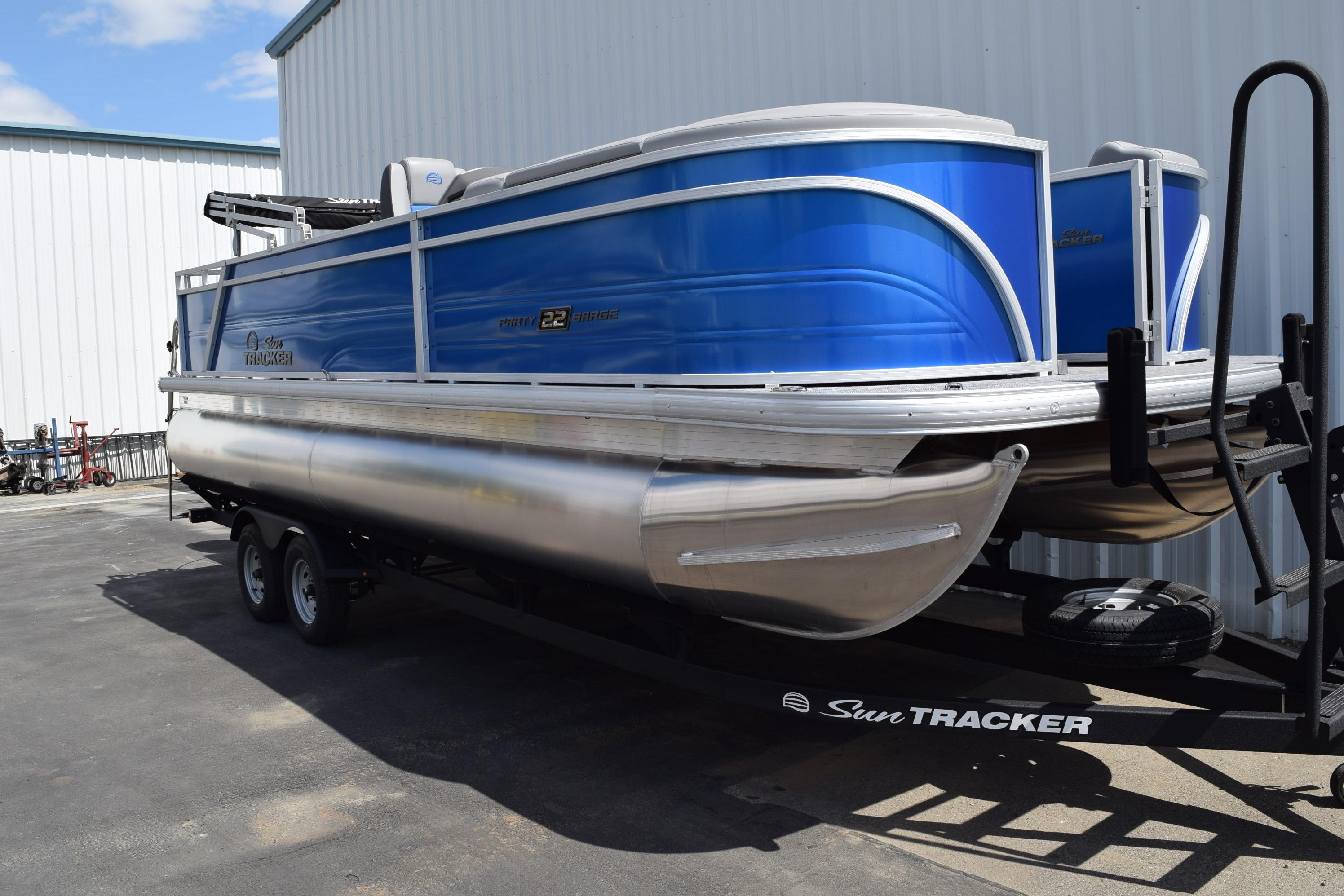 2026 Sun Tracker Party Barge 22 RF DLX pontoon boat on trailer.