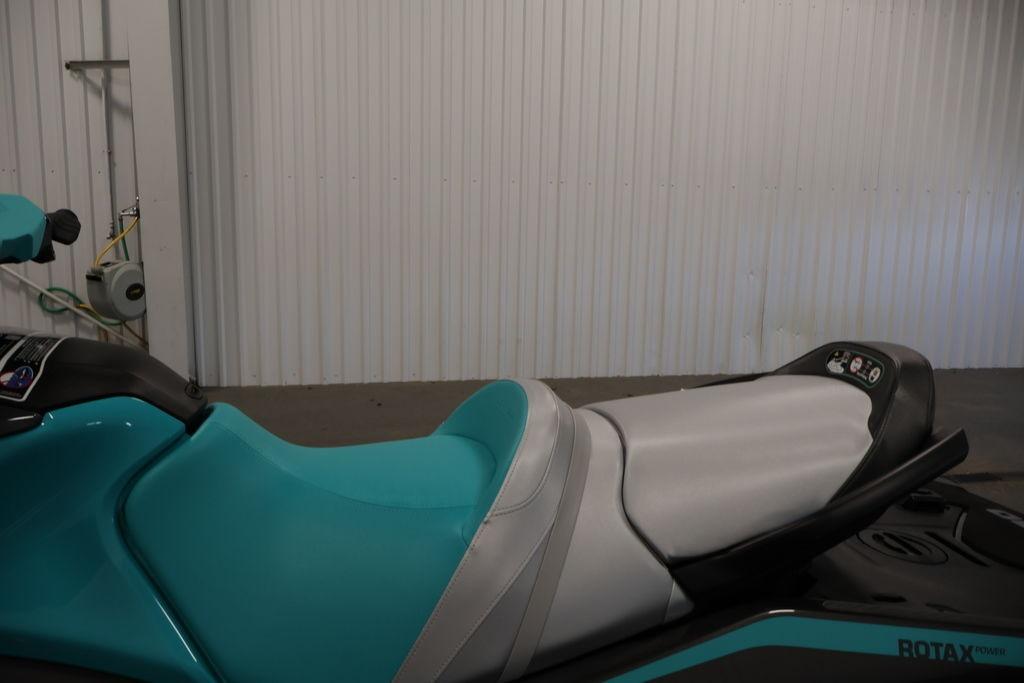 2026 Sea-Doo GTR 230 jet ski with turquoise and gray seating in a garage setting.