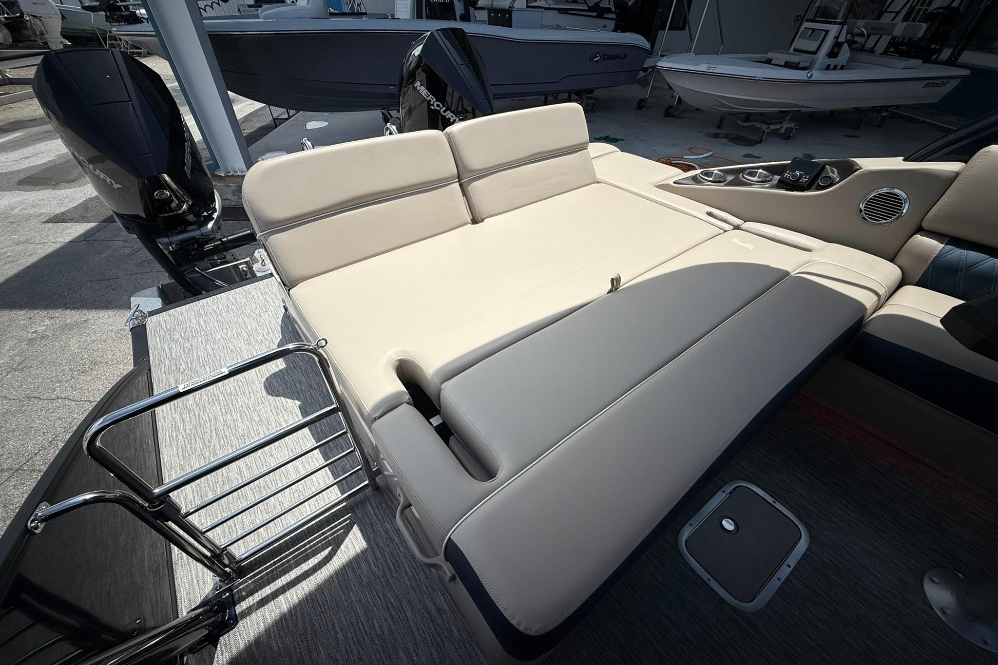 Luxurious seating on the 2026 Bennington 27 QSBAT2 pontoon boat, featuring sleek design and comfort.