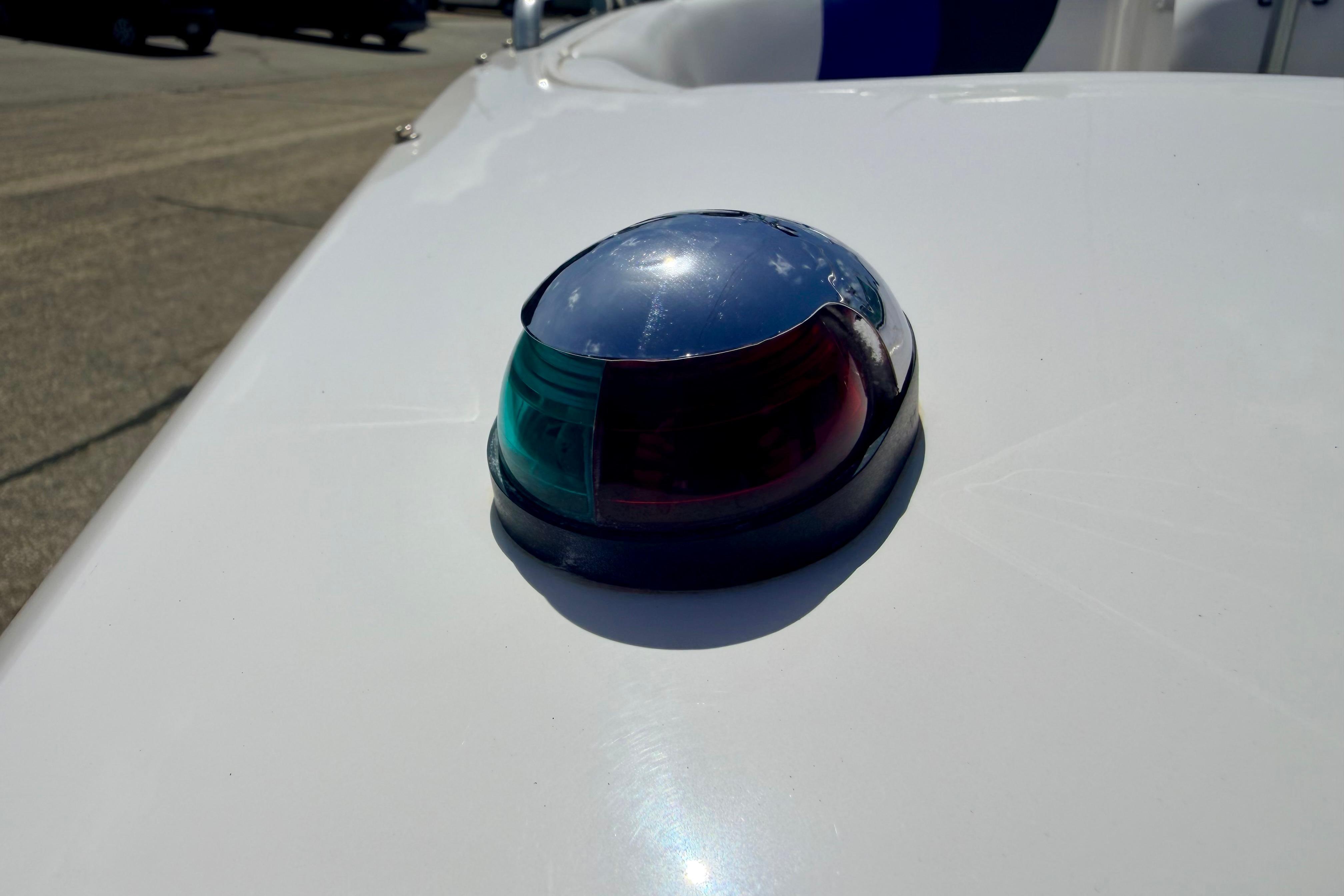 Navigation light on 2008 Moomba Outback V boat, featuring red and green lenses.