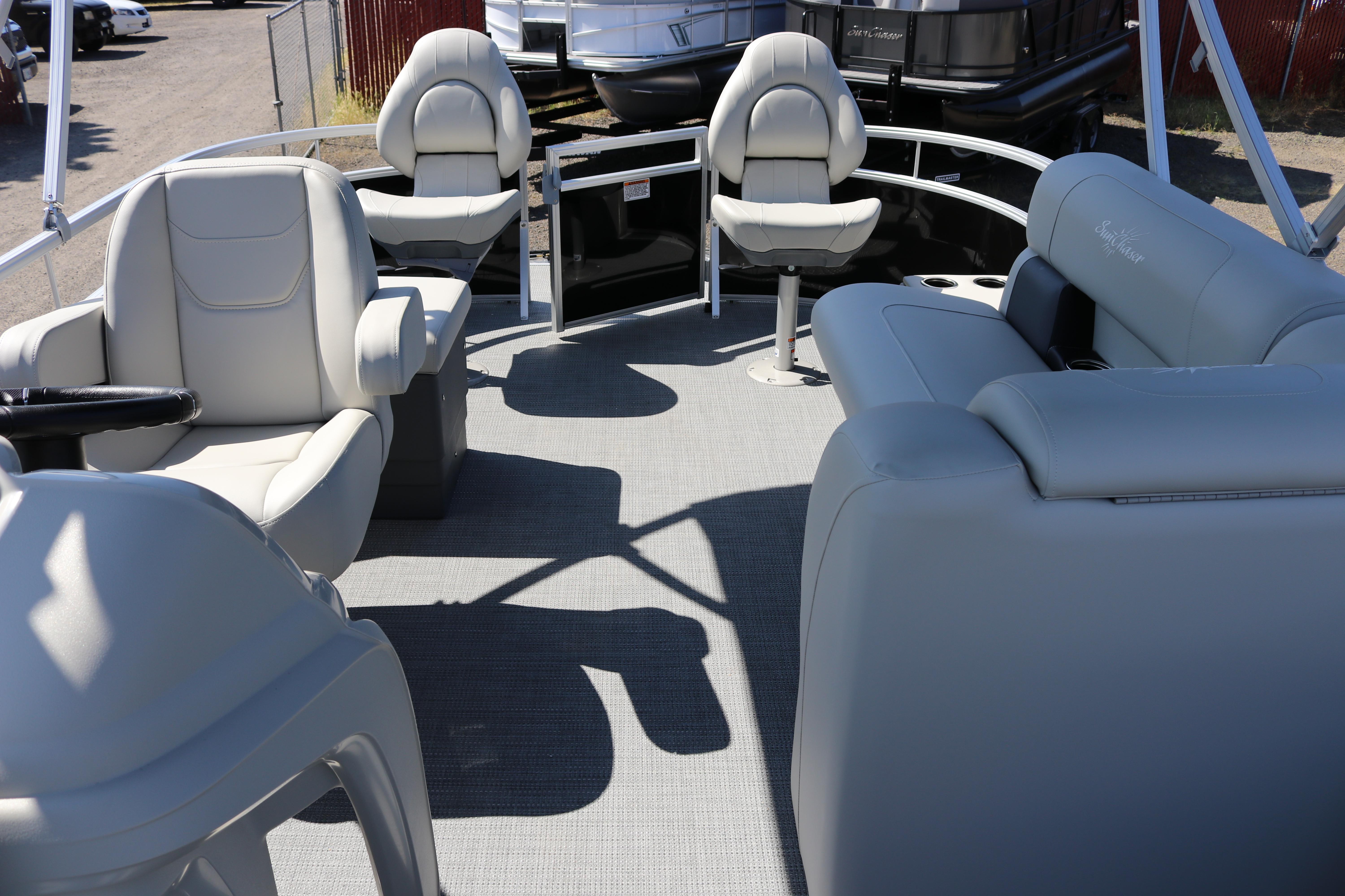 2025 SunChaser Vista 20 Fish pontoon boat interior with plush seating and steering console.