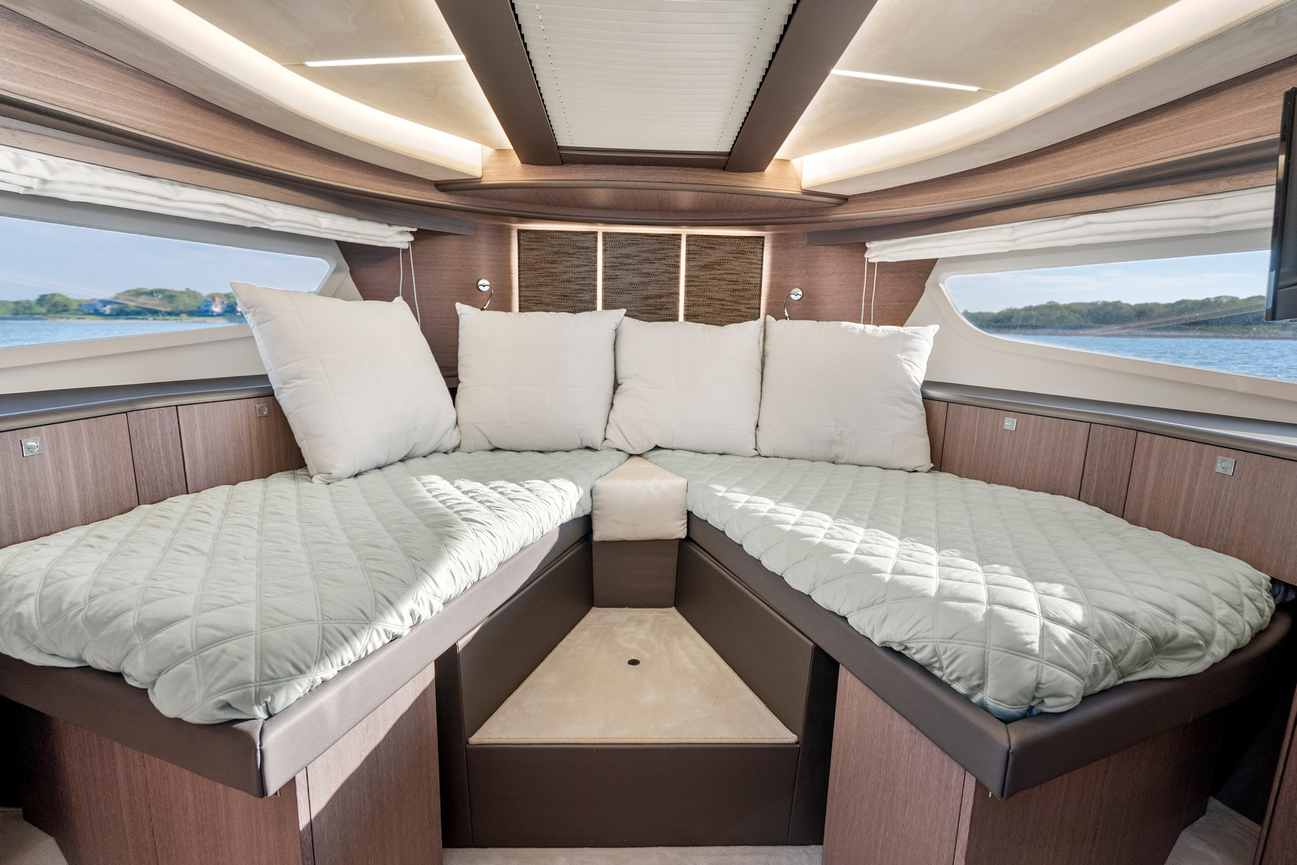 Luxurious interior of 2023 Galeon 400 Fly yacht with comfortable bedding.