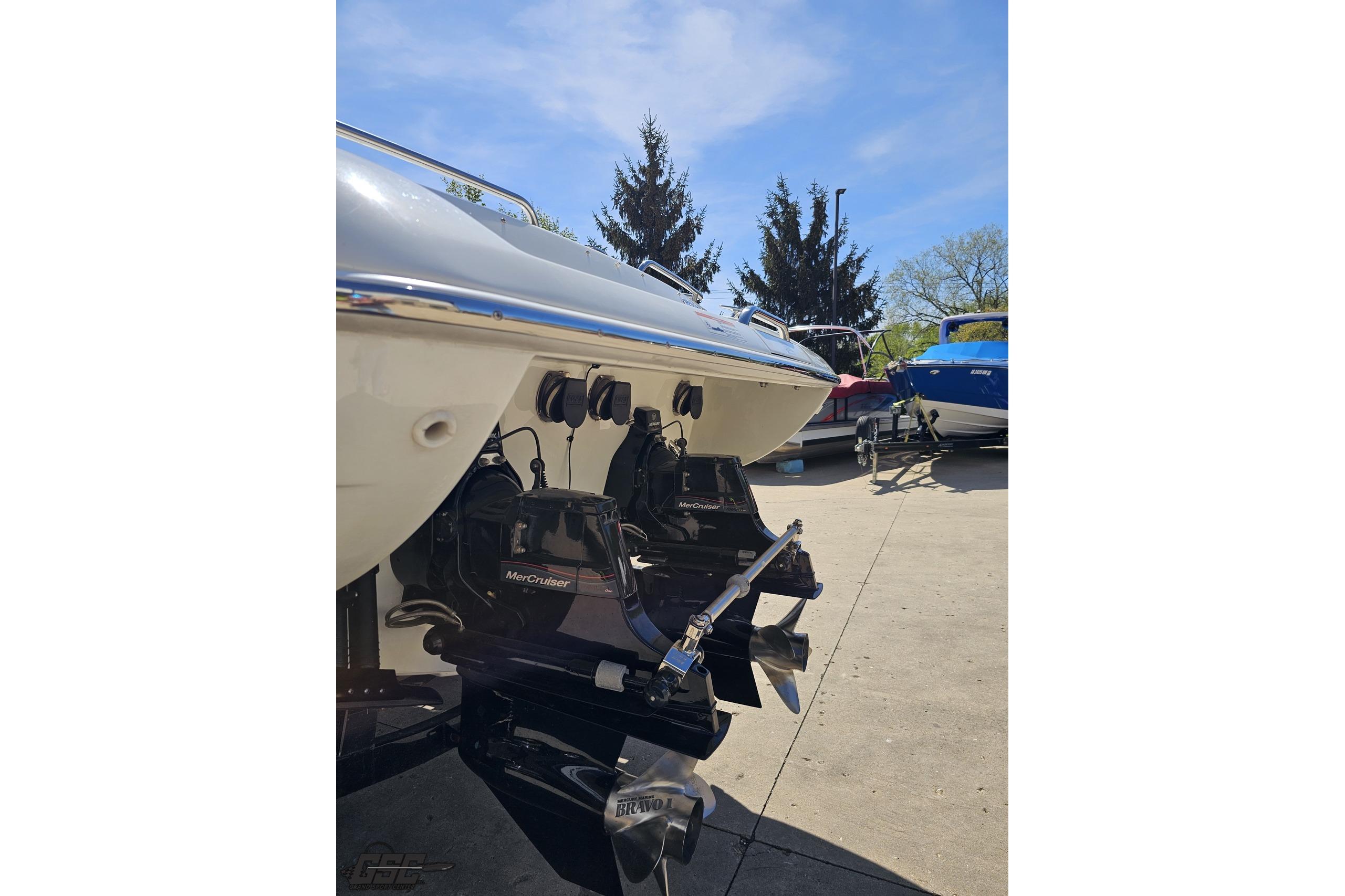 2014 Formula 292 FASTech boat with MerCruiser engines, parked outdoors on a sunny day.