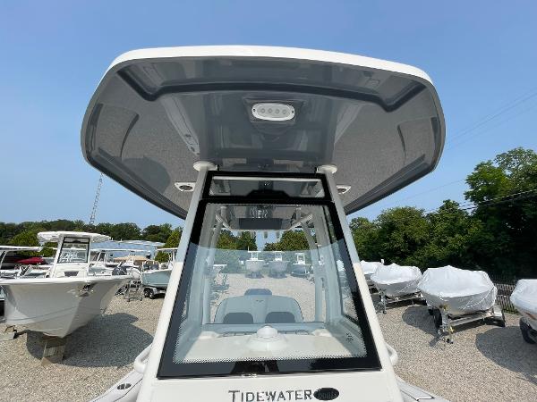 2025 Tidewater 232 CC Adventure boat with T-top, displayed outdoors.