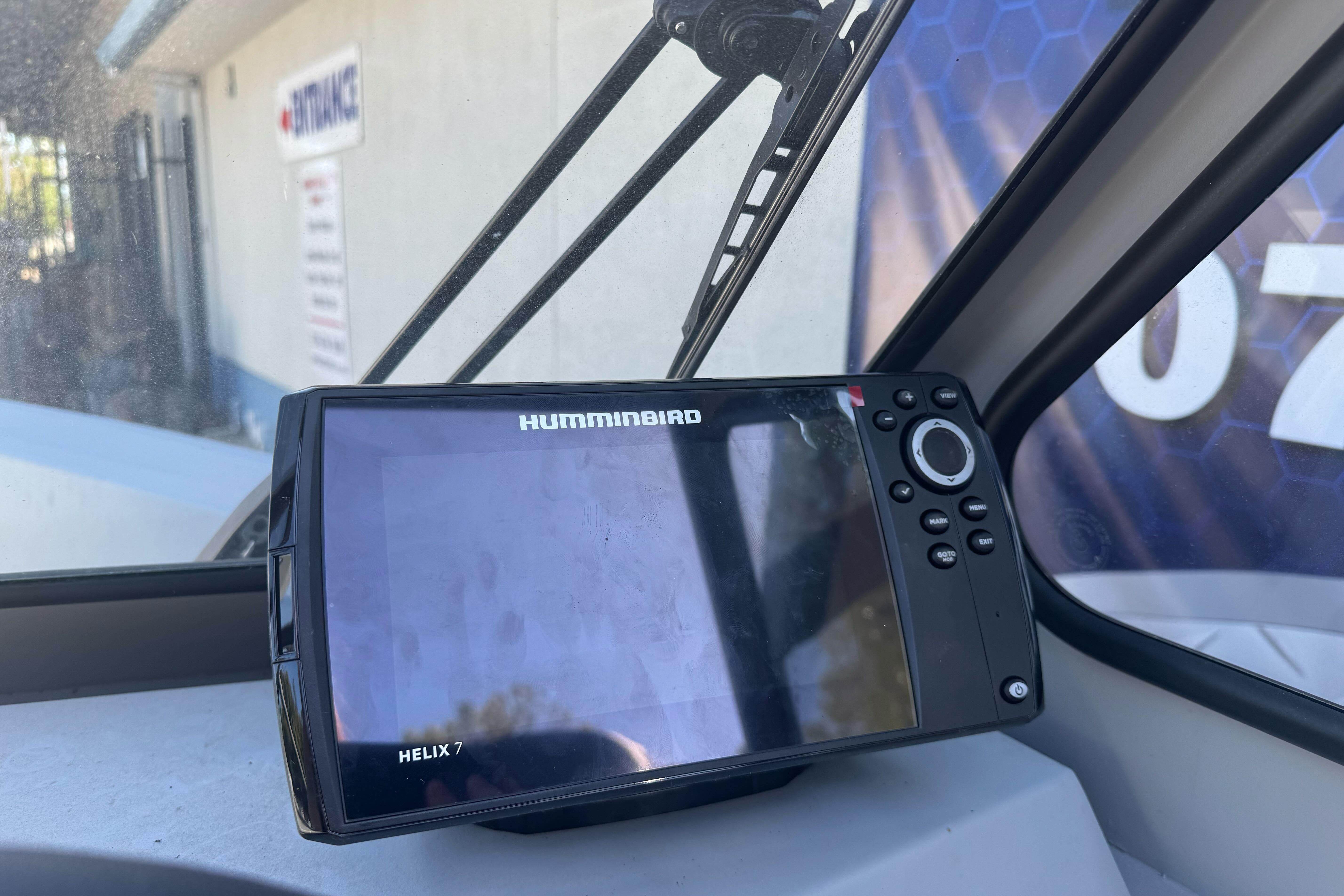 Humminbird Helix 7 fish finder inside 2026 KingFisher 16 Falcon boat cockpit.