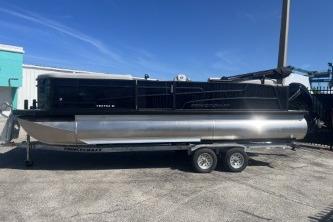 2026 Princecraft Vectra 23 L pontoon boat on trailer, parked outdoors under clear blue sky.