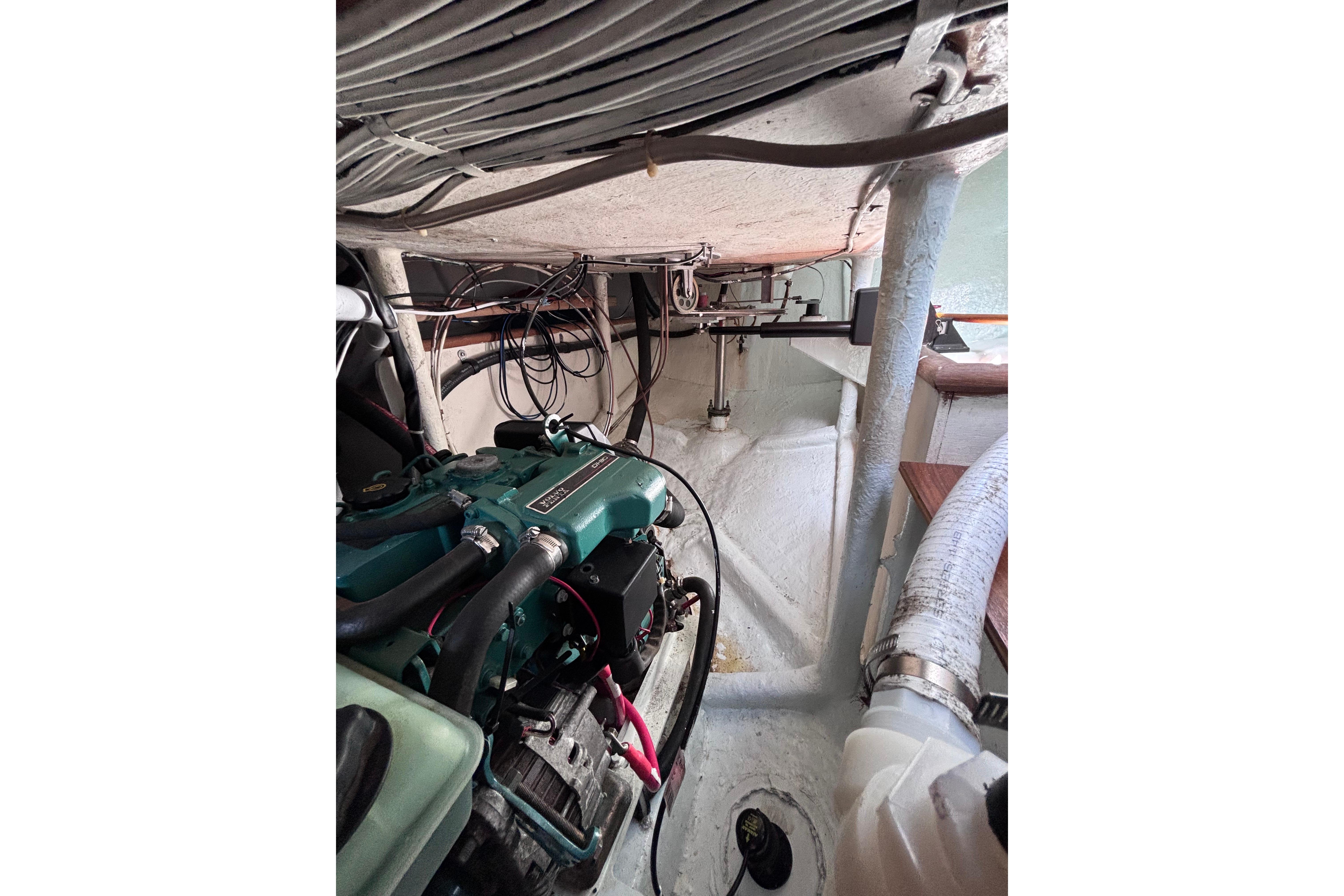 Engine compartment of a 1978 Swift 33 boat, showcasing mechanical components and wiring.