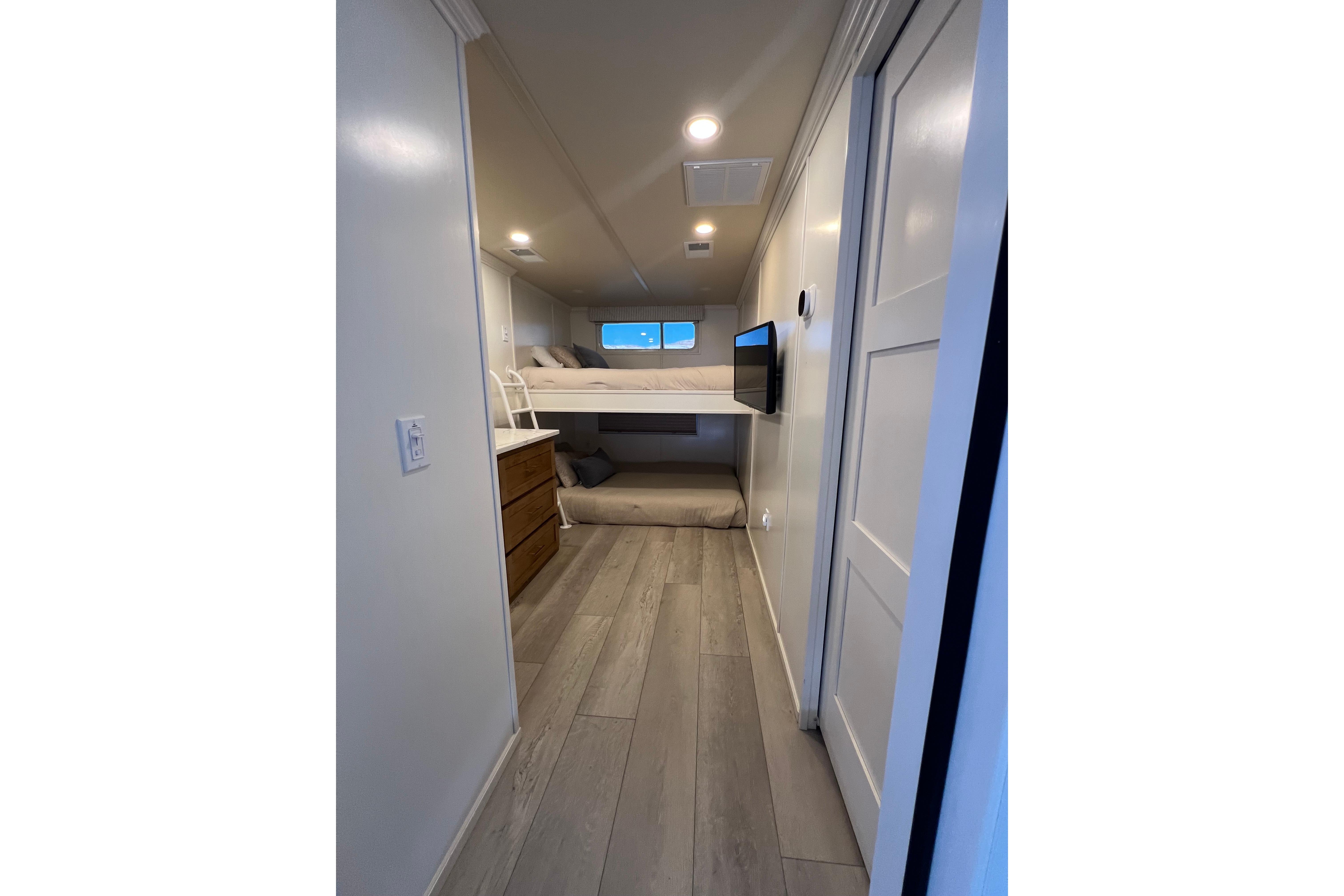 Modern interior of 2025 Sumerset Excellence Multiple Shares with bunk beds and sleek design.