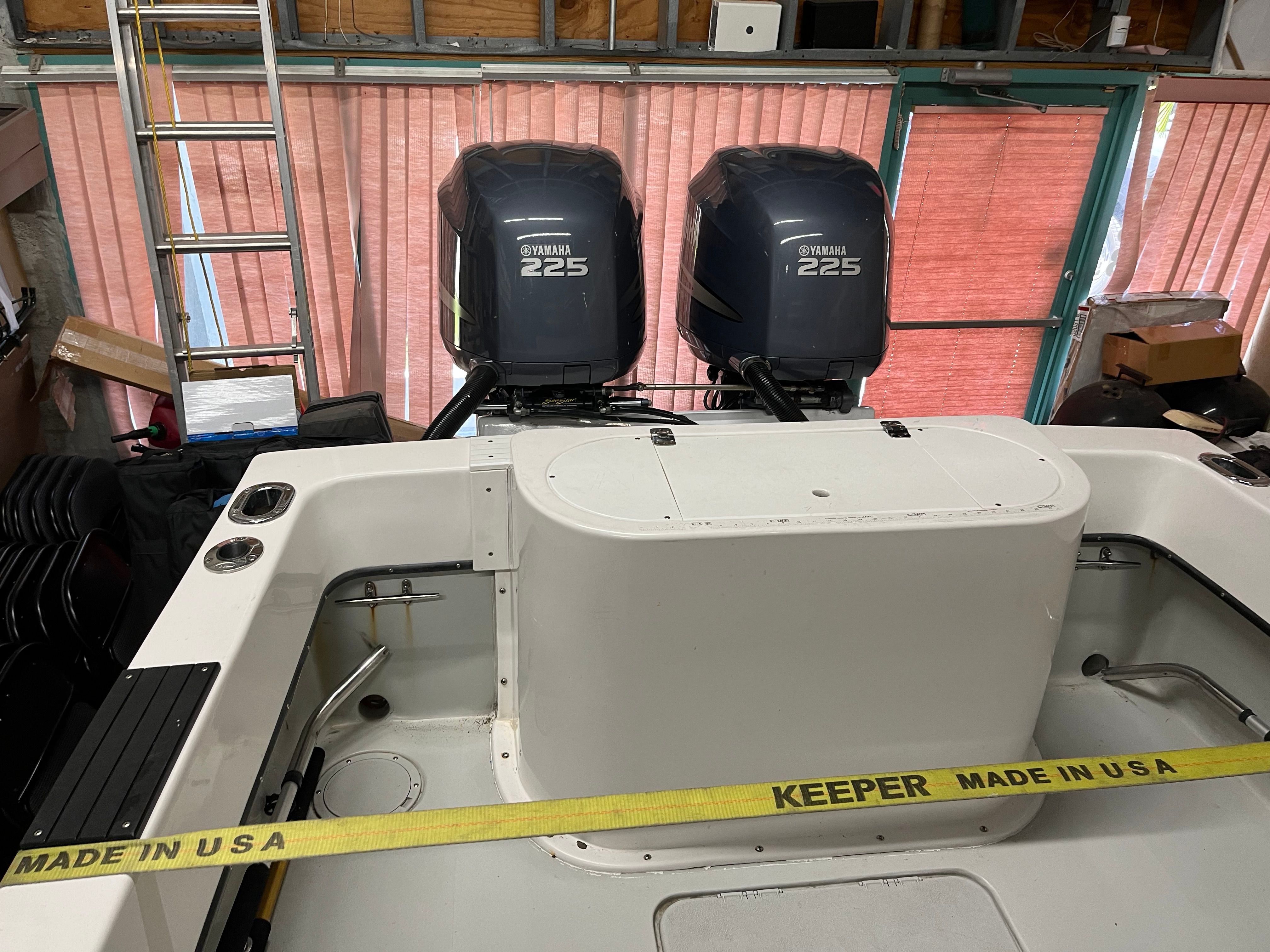 The image shows the stern of a boat with two Yamaha 225 outboard engines.