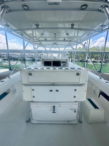 2008 SeaVee 390B boat interior with helm station and storage compartments.