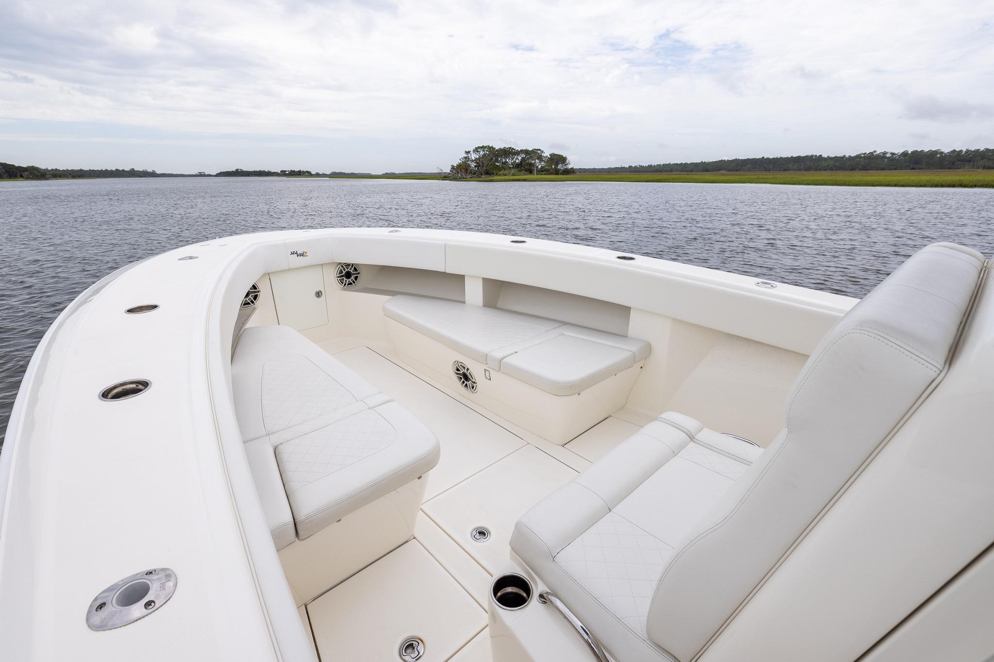 2019 SeaVee 322Z boat interior with white seating on calm water.