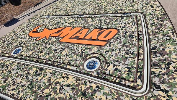 2025 Mako 18 Pro Skiff Backwater Edition with camouflage design and bold orange logo.