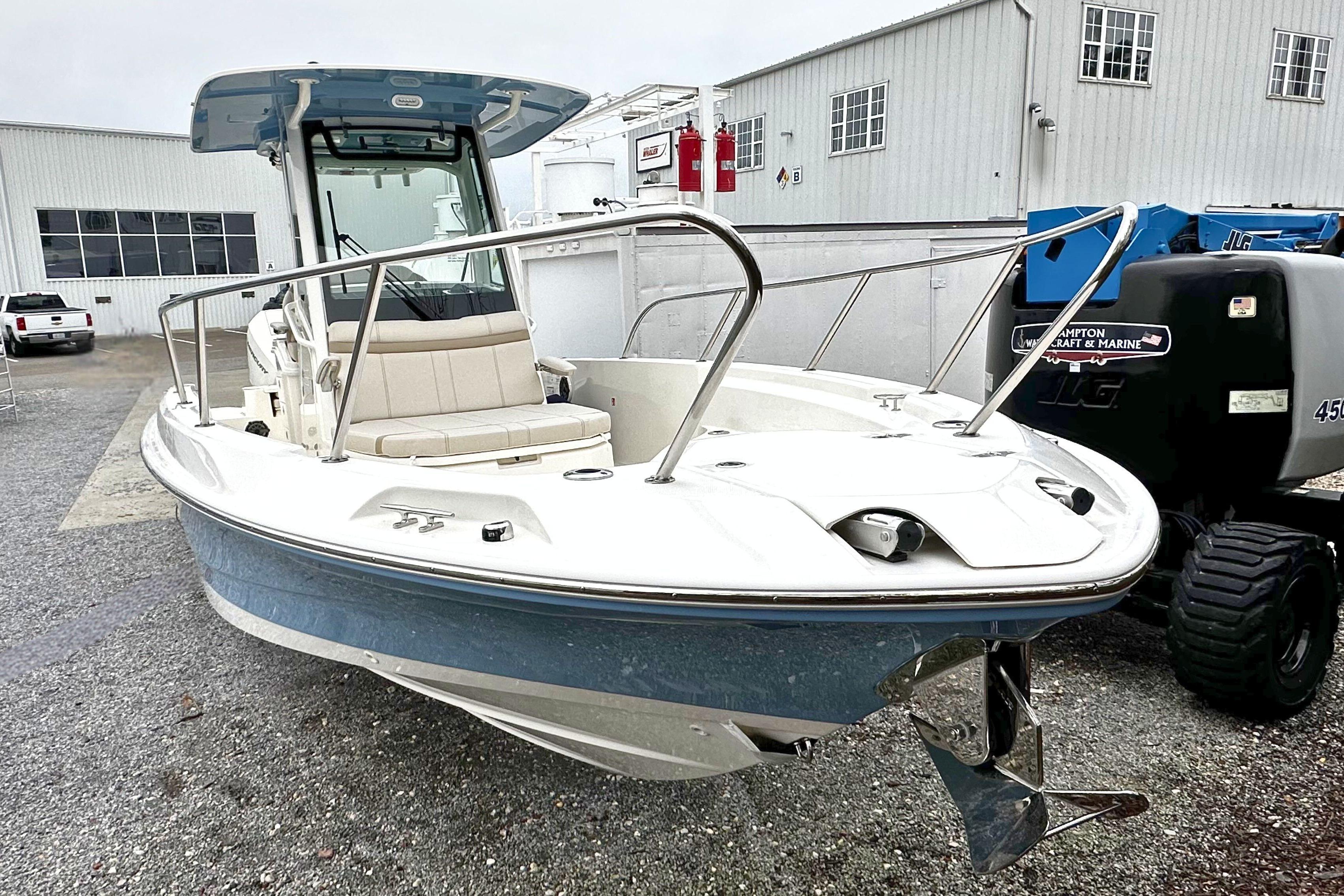 2026 Boston Whaler 280 Dauntless boat in a marina setting, showcasing sleek design.
