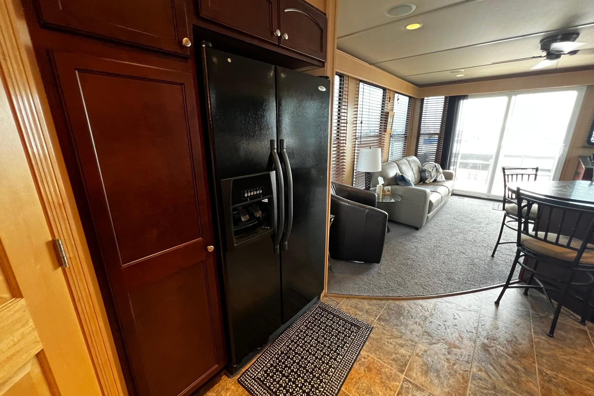 Luxurious Skipperliner 480 Flybridge interior with modern kitchen and cozy living area, 2010 model.