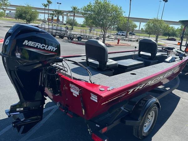 2025 Tracker Panfish 17 boat with Mercury engine, parked outdoors on a sunny day.