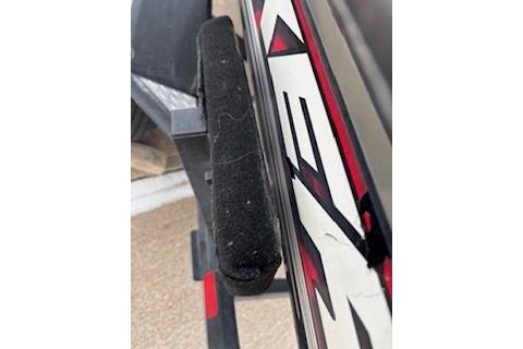 2018 Tracker Pro Team 175 TXW boat detail with black and red graphics.