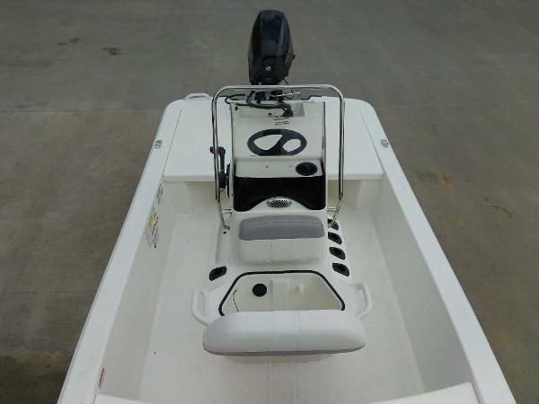 2025 Mako Pro Skiff 13 CC boat interior with steering console and seating.
