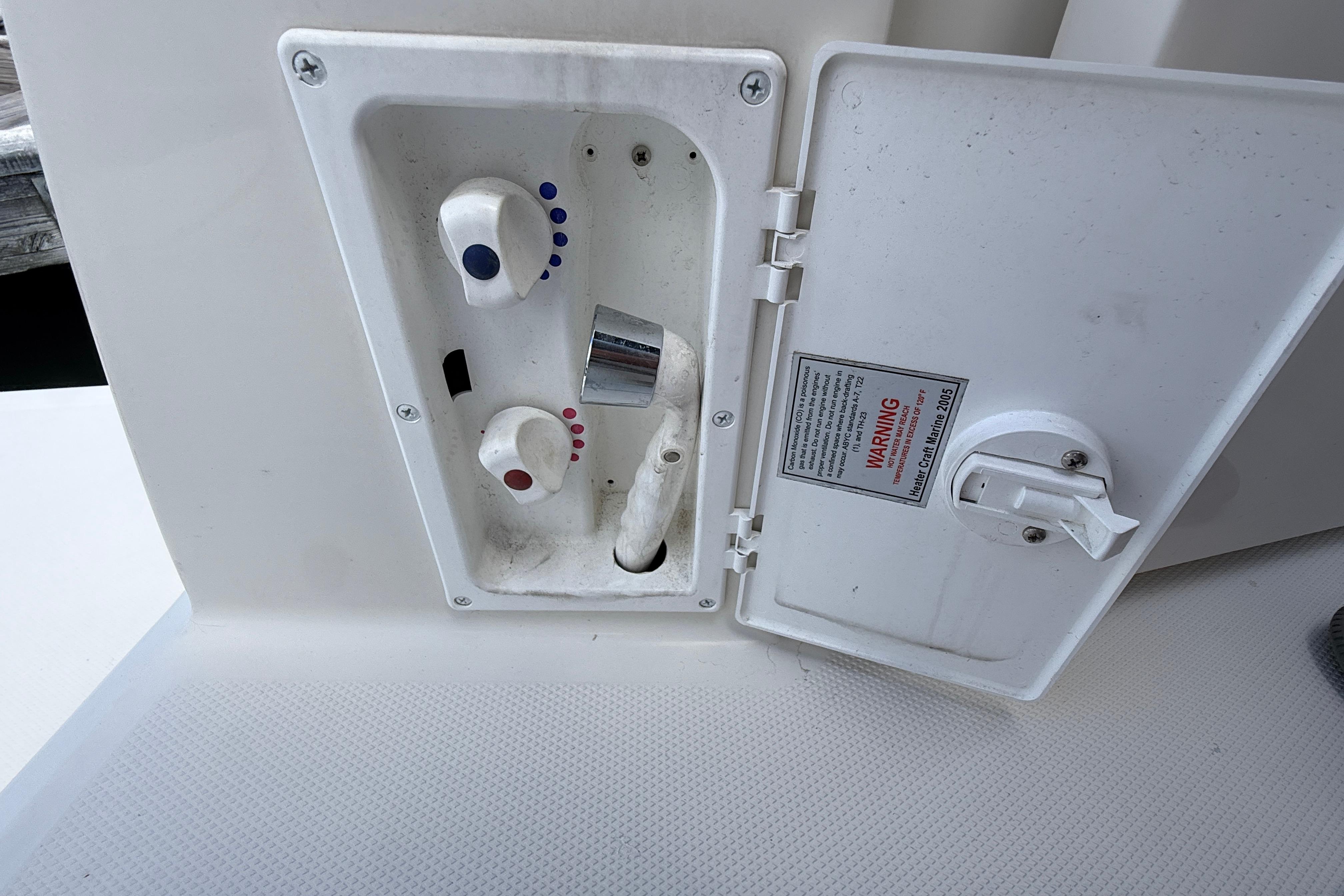 Control panel on a 2011 Monterey 320 Sport Yacht with temperature knobs.
