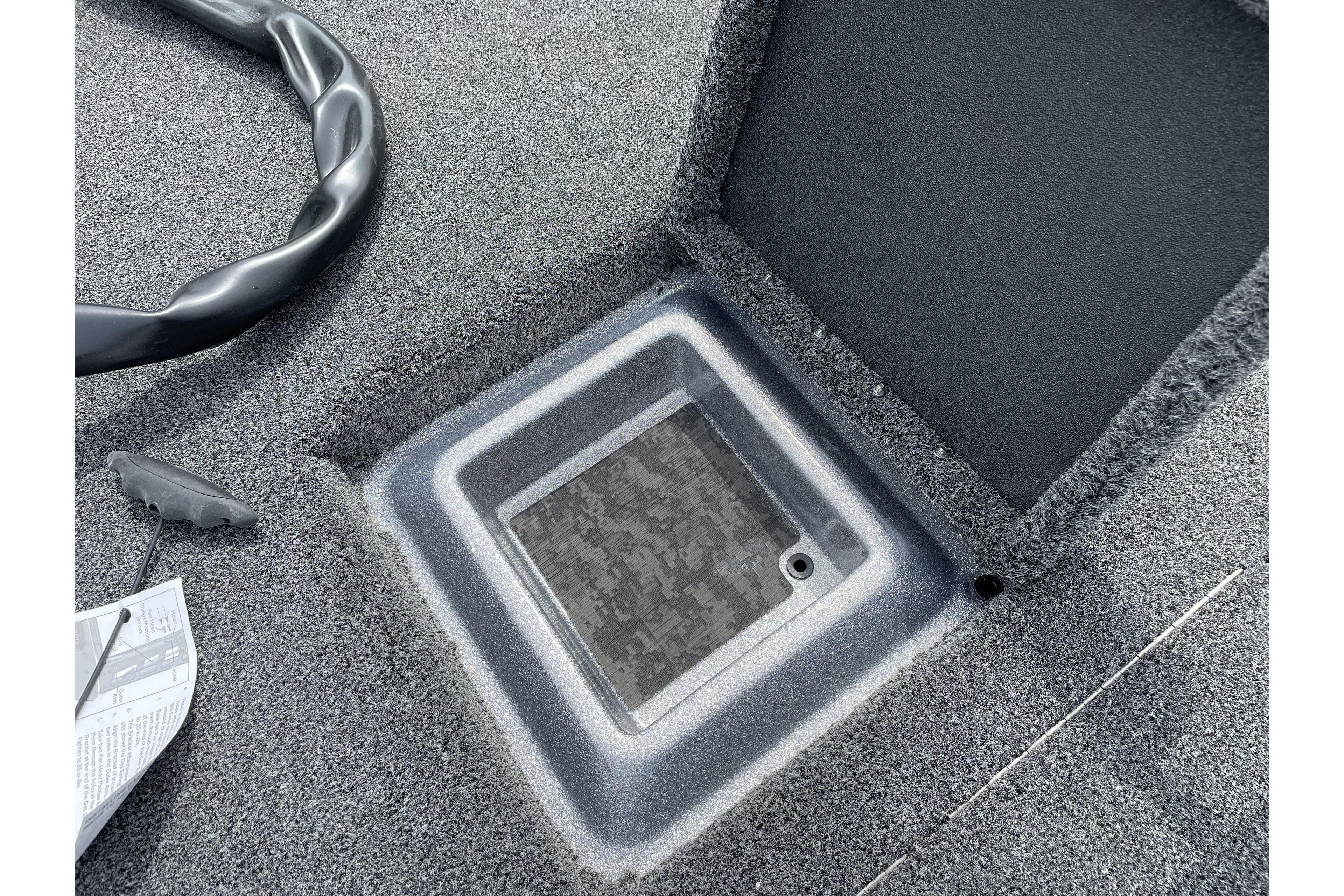 Open storage compartment on 2026 Nitro Z21 XL boat deck.