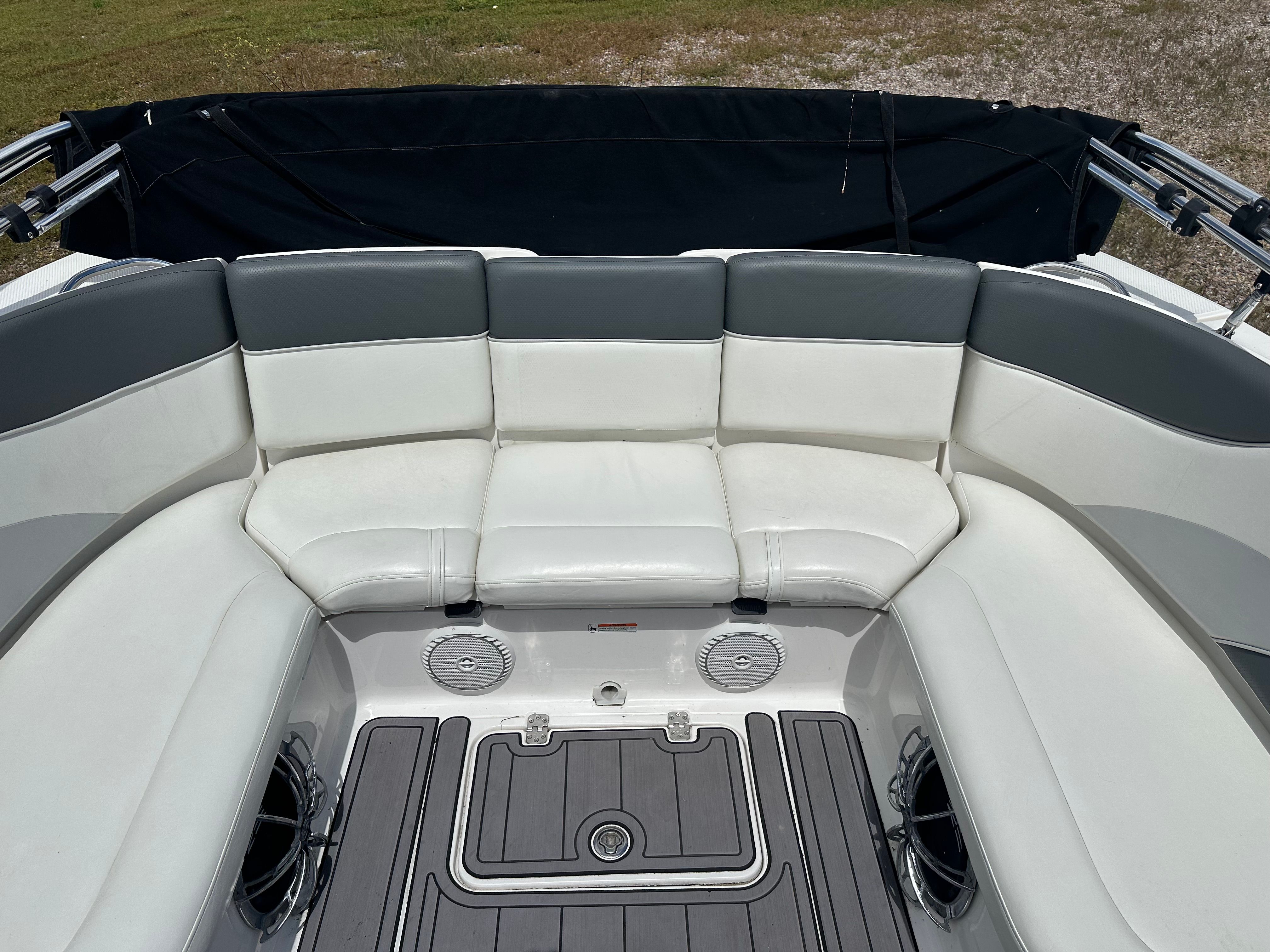 Interior of a 2005 Yamaha AR230 HO boat with white seating.