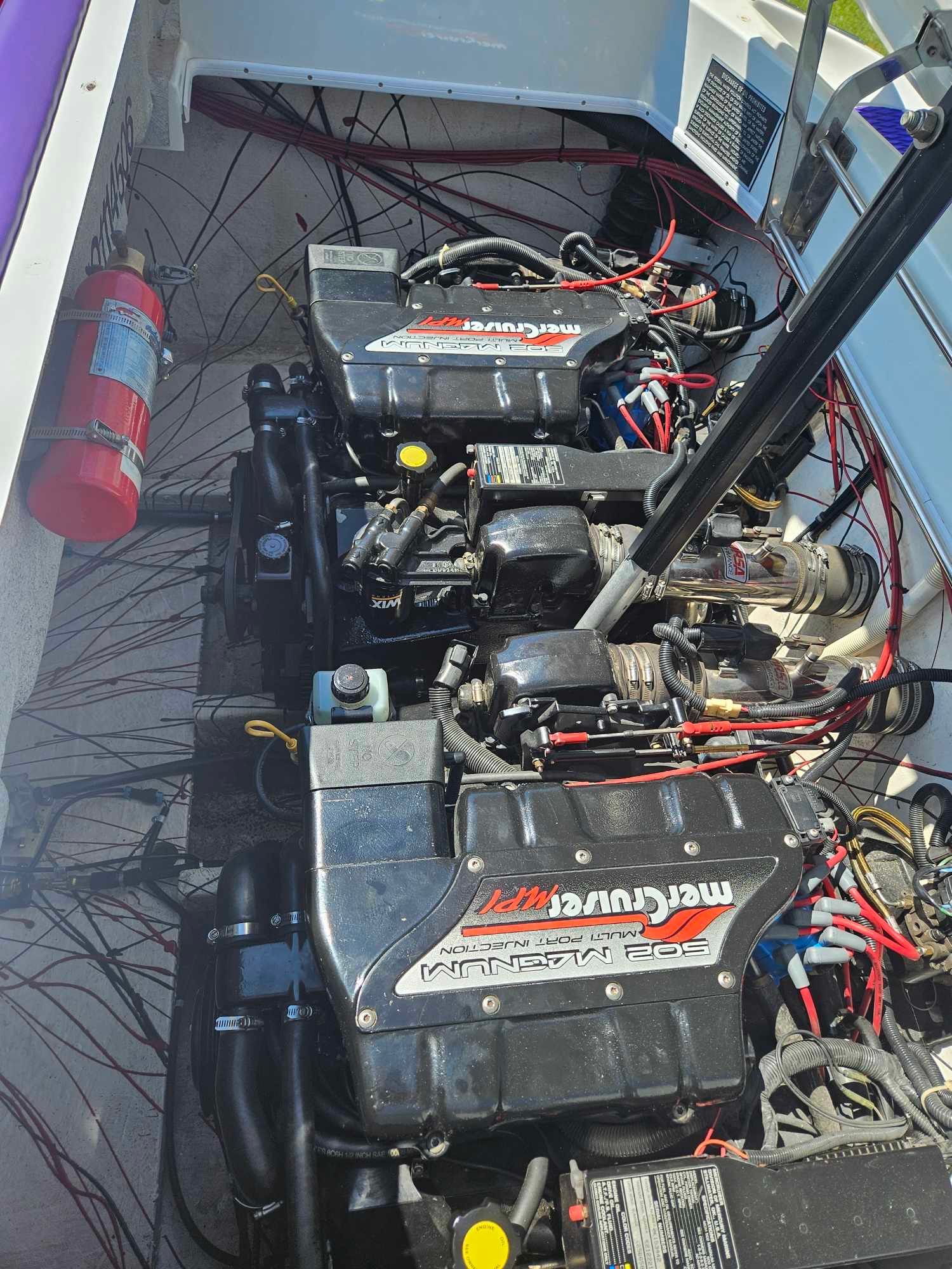 Engine compartment of a 1997 Baja 38 Special Boss with MerCruiser engines.