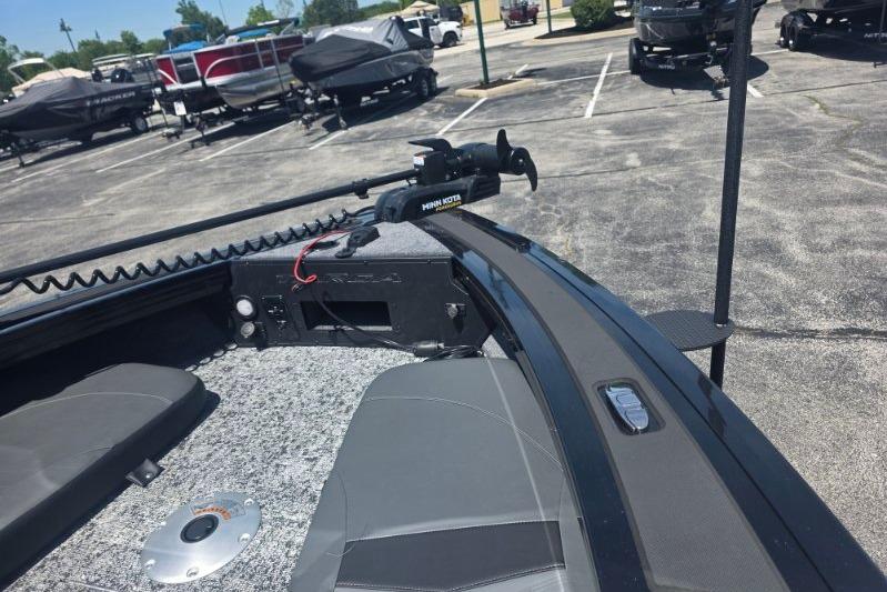2026 Tracker Targa V-18 Combo boat with Minn Kota trolling motor in parking lot.