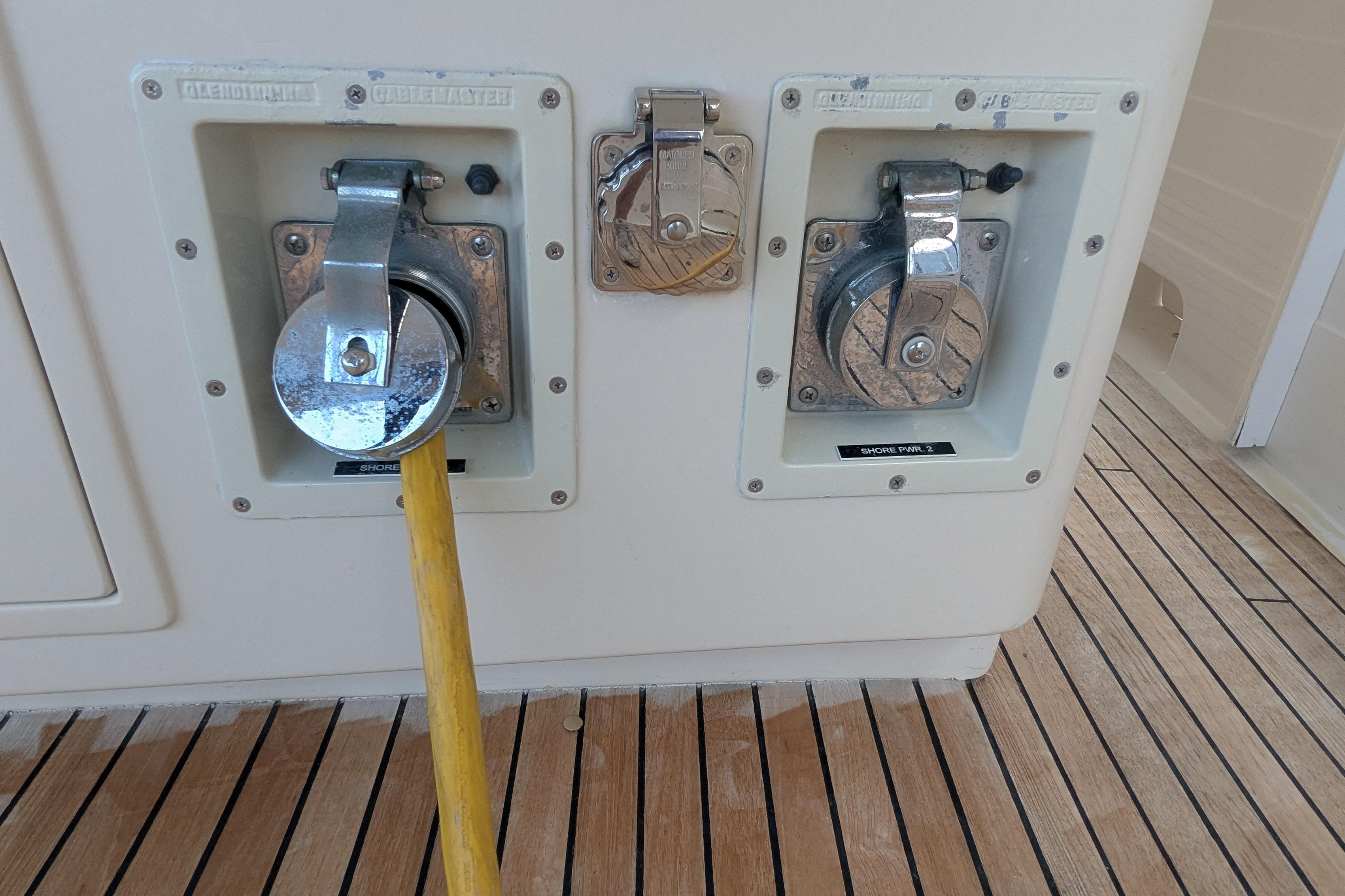 2005 Kadey-Krogen Pilothouse shore power connections on teak deck.