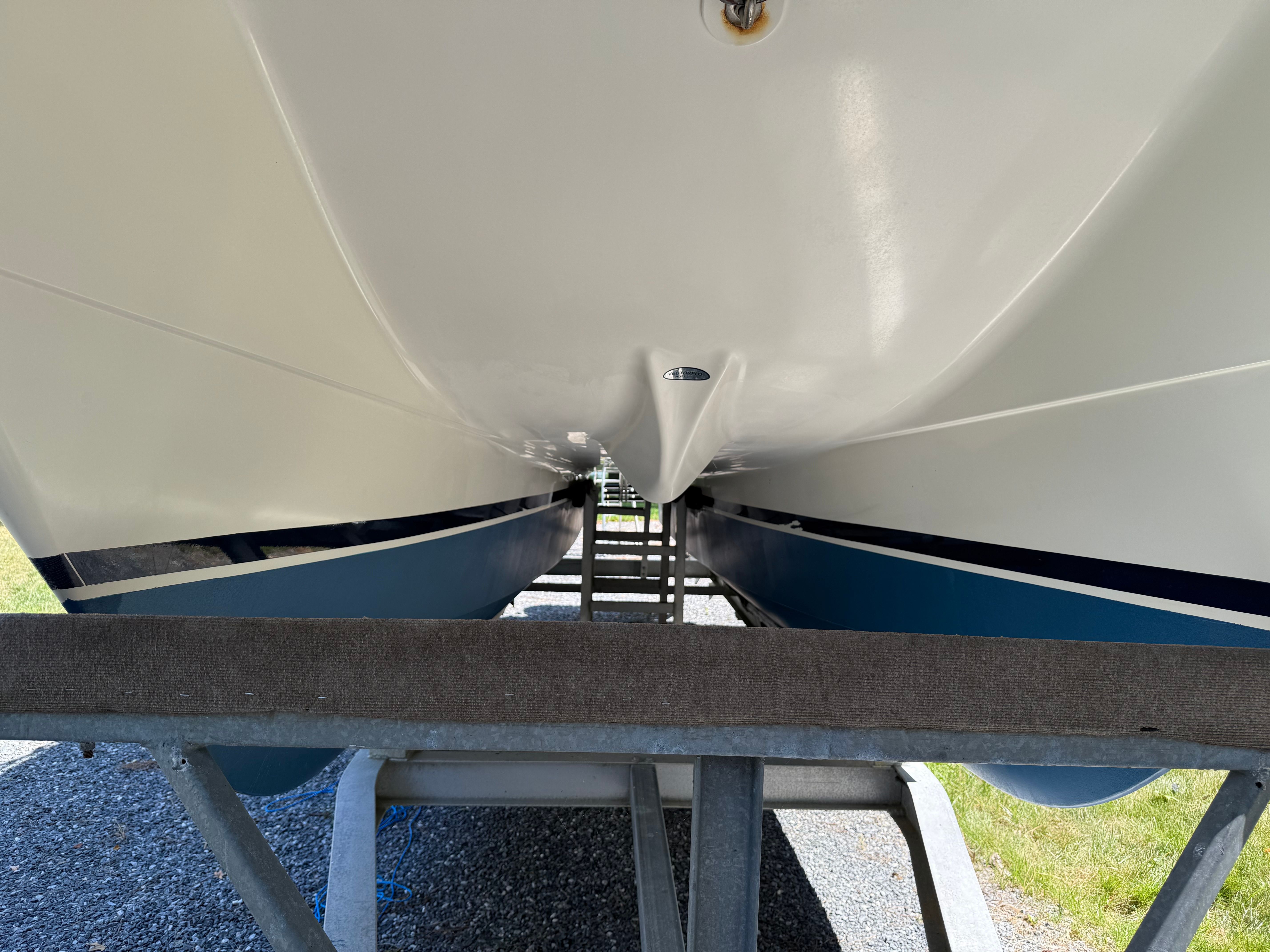 Underside of a 2002 World Cat 246 DC boat on a trailer.
