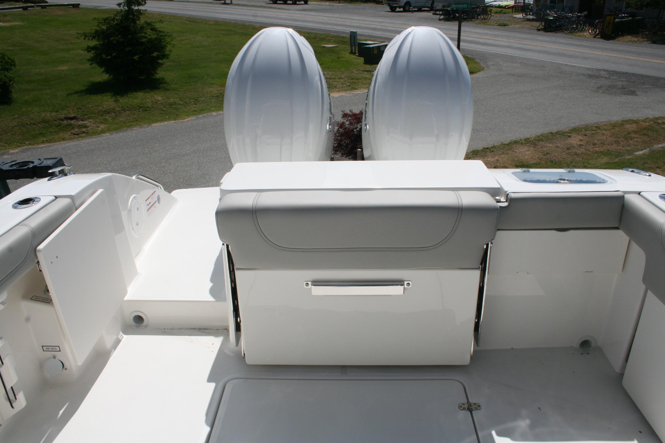 2026 Pursuit DC 266 Dual Console boat with dual engines and spacious seating area.