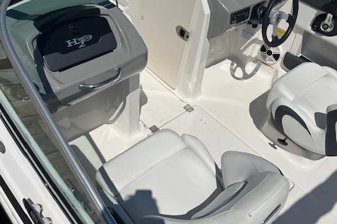 2015 Chaparral 21 H2O Sport boat interior with white seating and steering wheel.