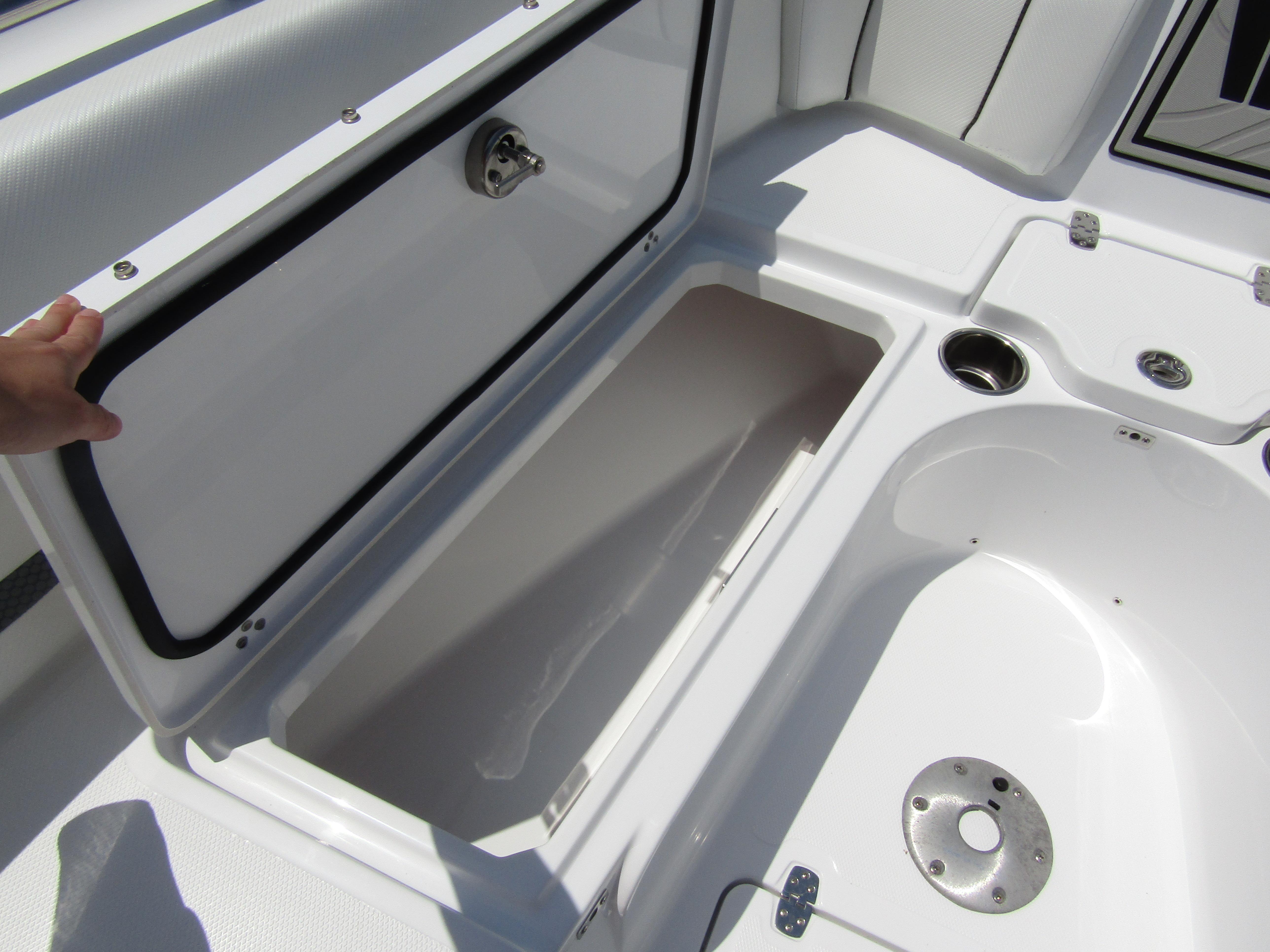 2024 Wellcraft 243 Fisherman boat storage compartment and seating area.