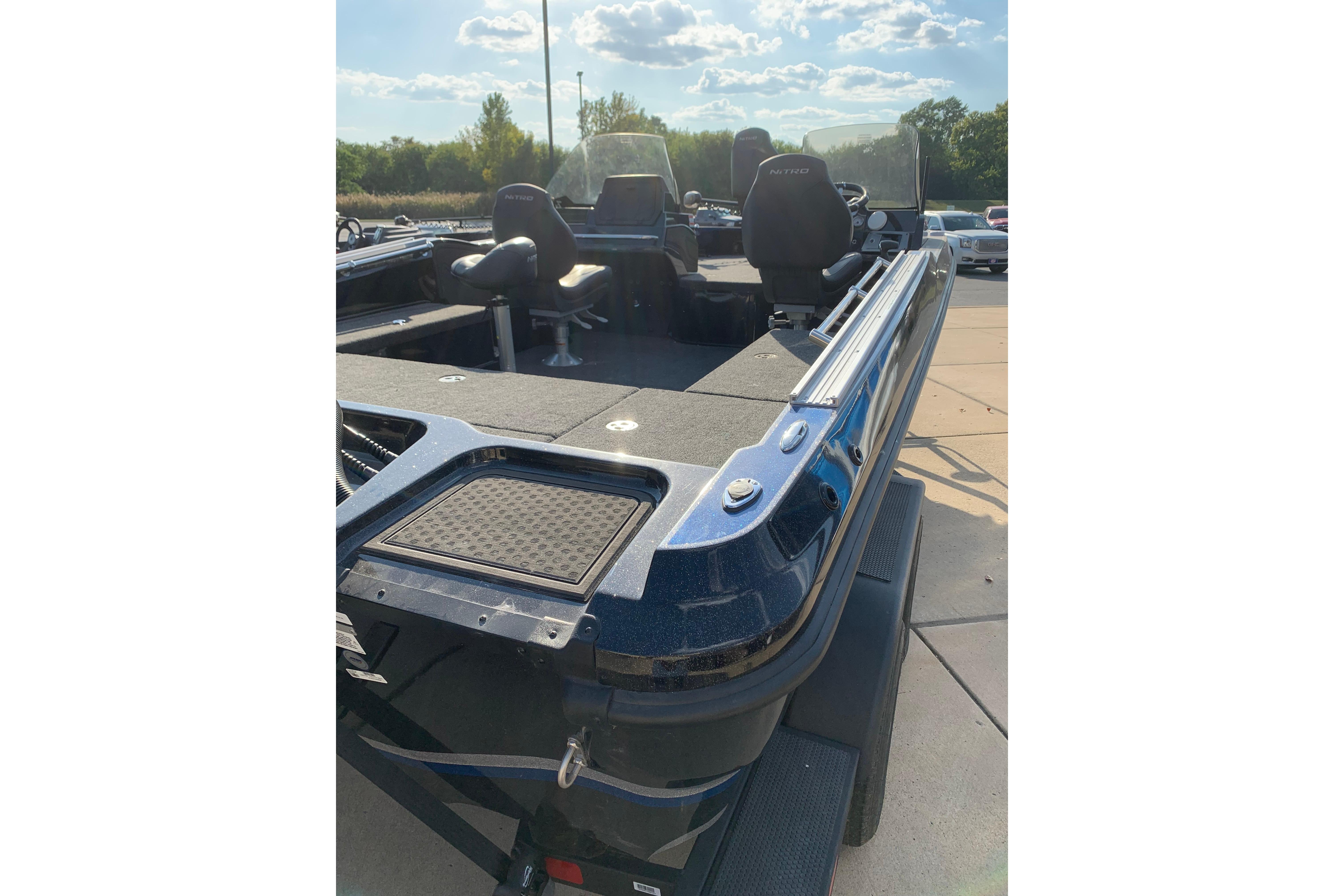 2025 Nitro ZV20 boat with spacious deck and seating, under a clear sky.