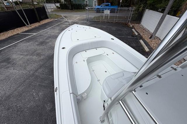 2025 Contender 26 Bay boat with sleek white deck and seating.