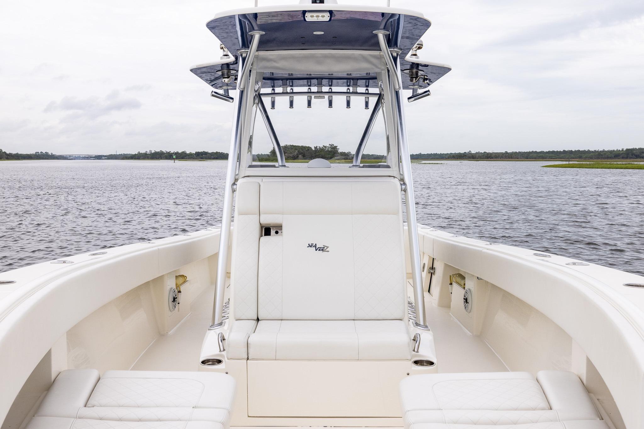 2019 SeaVee 322Z boat interior with seating, on a calm water backdrop.