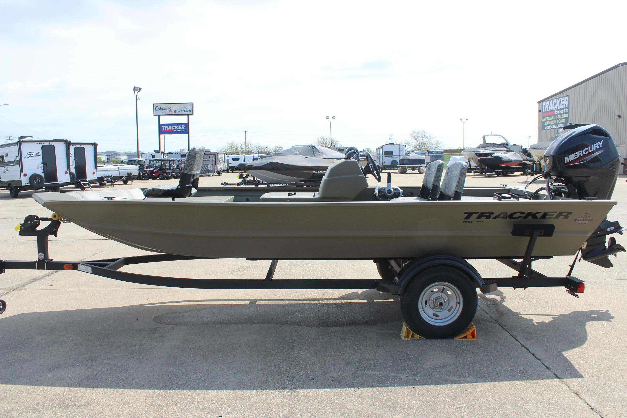 2026 Tracker Grizzly 1754 SC boat on trailer, displayed outdoors.