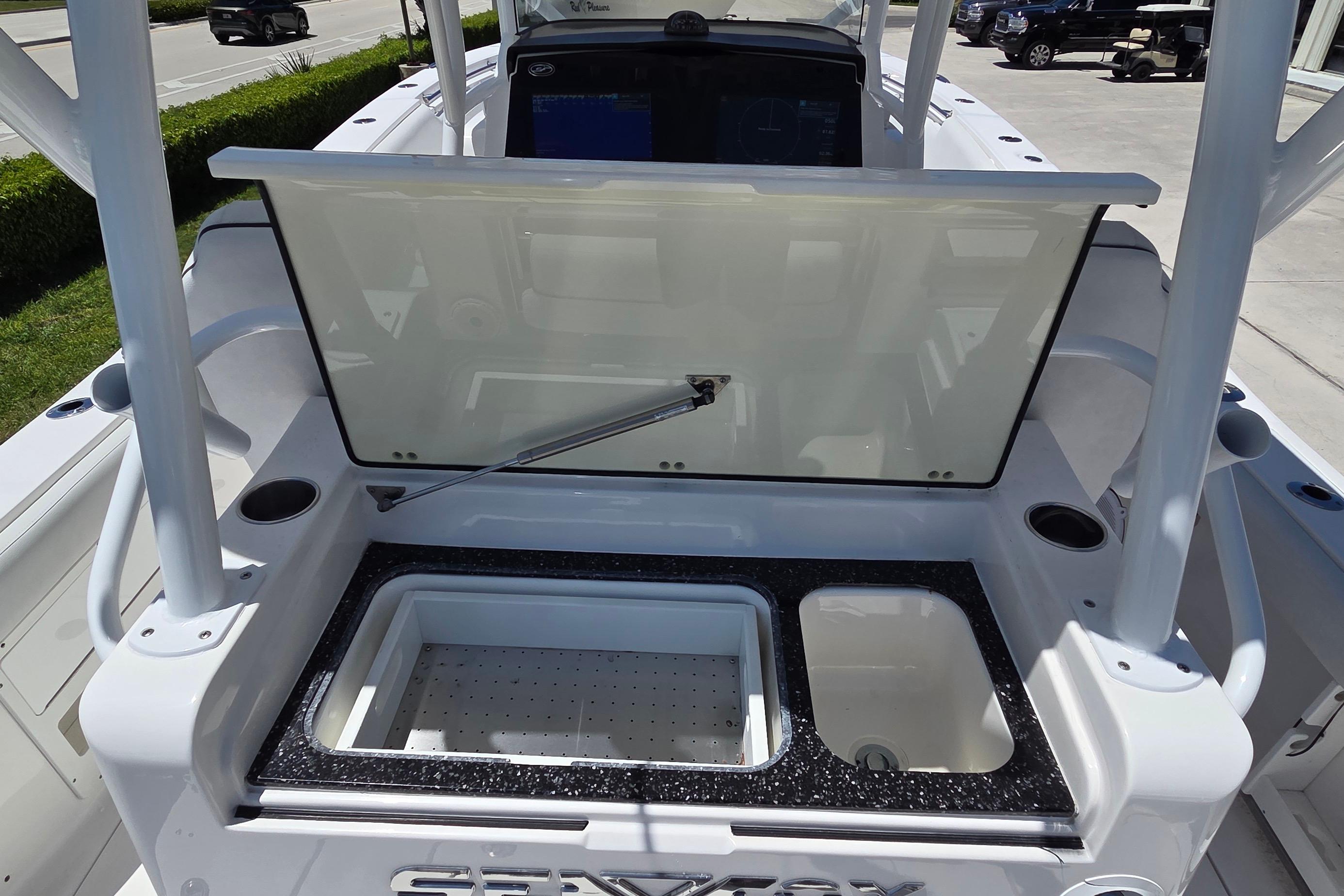 2021 Sea Fox 328 Commander boat with open storage compartment and sink.