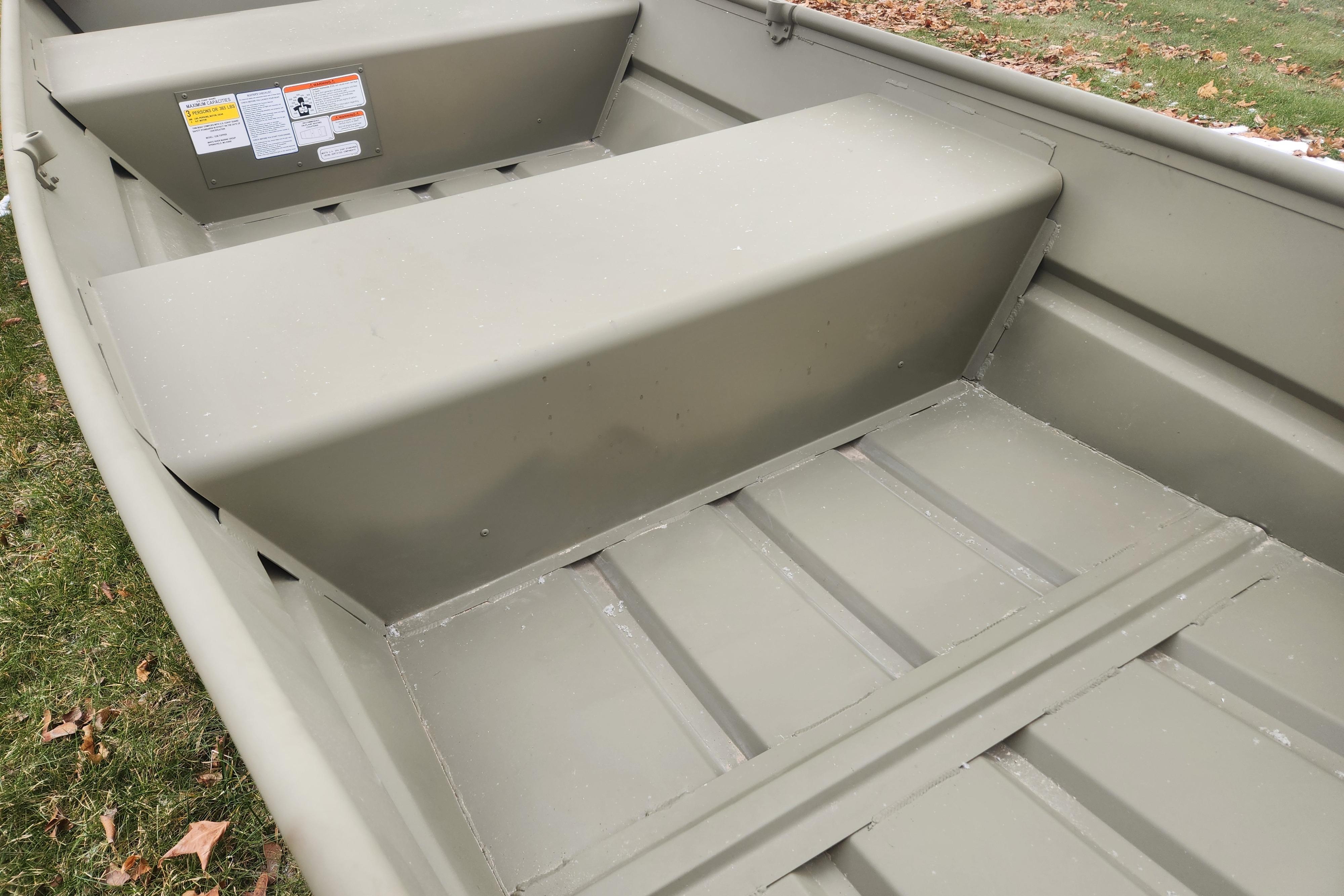 2026 Tracker Grizzly 12 Jon boat interior, showcasing sturdy seating and durable construction.