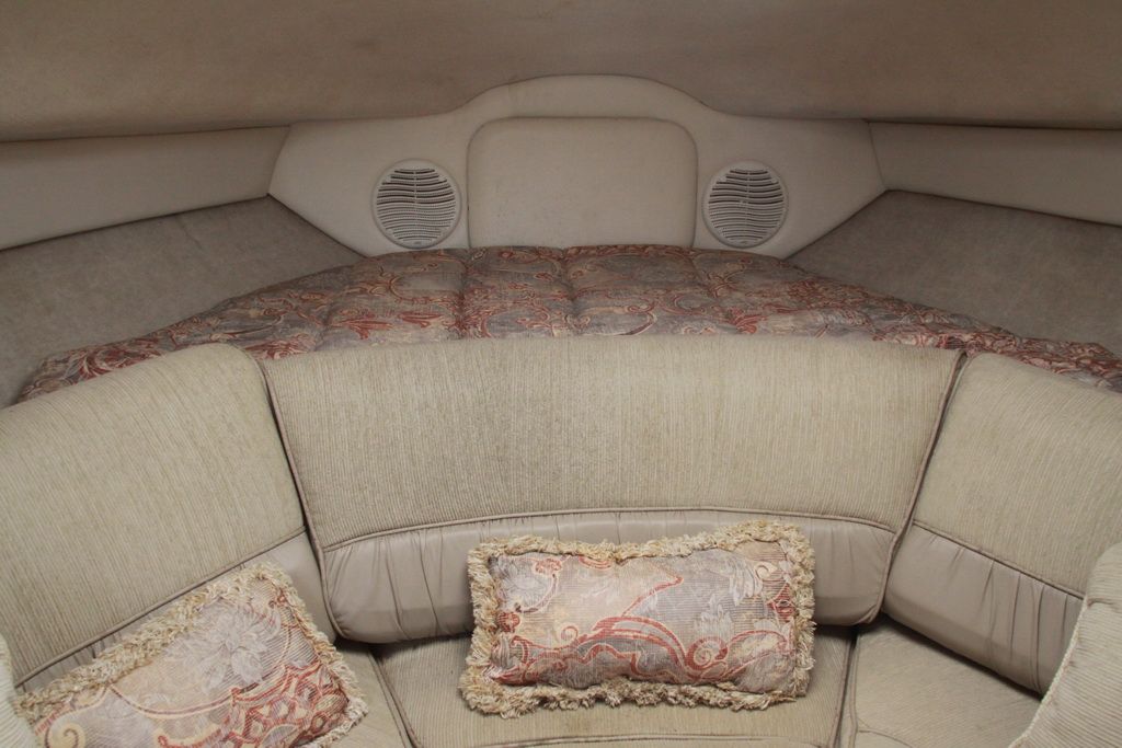 Interior of 1999 Maxum 2400 Mercruiser with cozy upholstery.