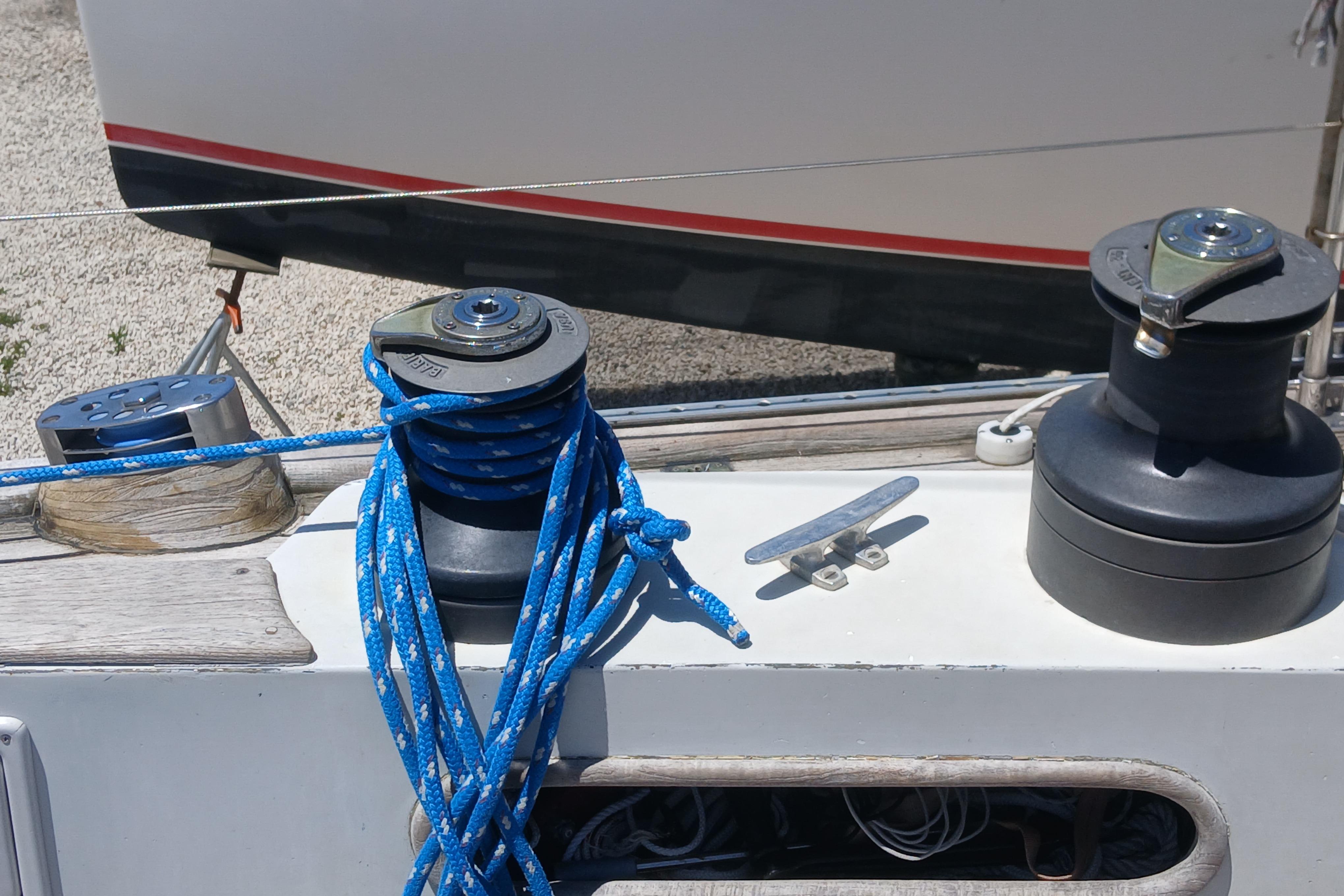 Deck of 1981 Kaufman Skye 51 sailboat with winches and blue rope.