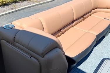2026 Regency 250 DL boat interior with tan seating and cup holder.
