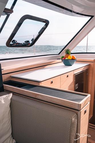 2025 Nautitech 40 Open interior with fruit bowl, ocean view, and modern design.