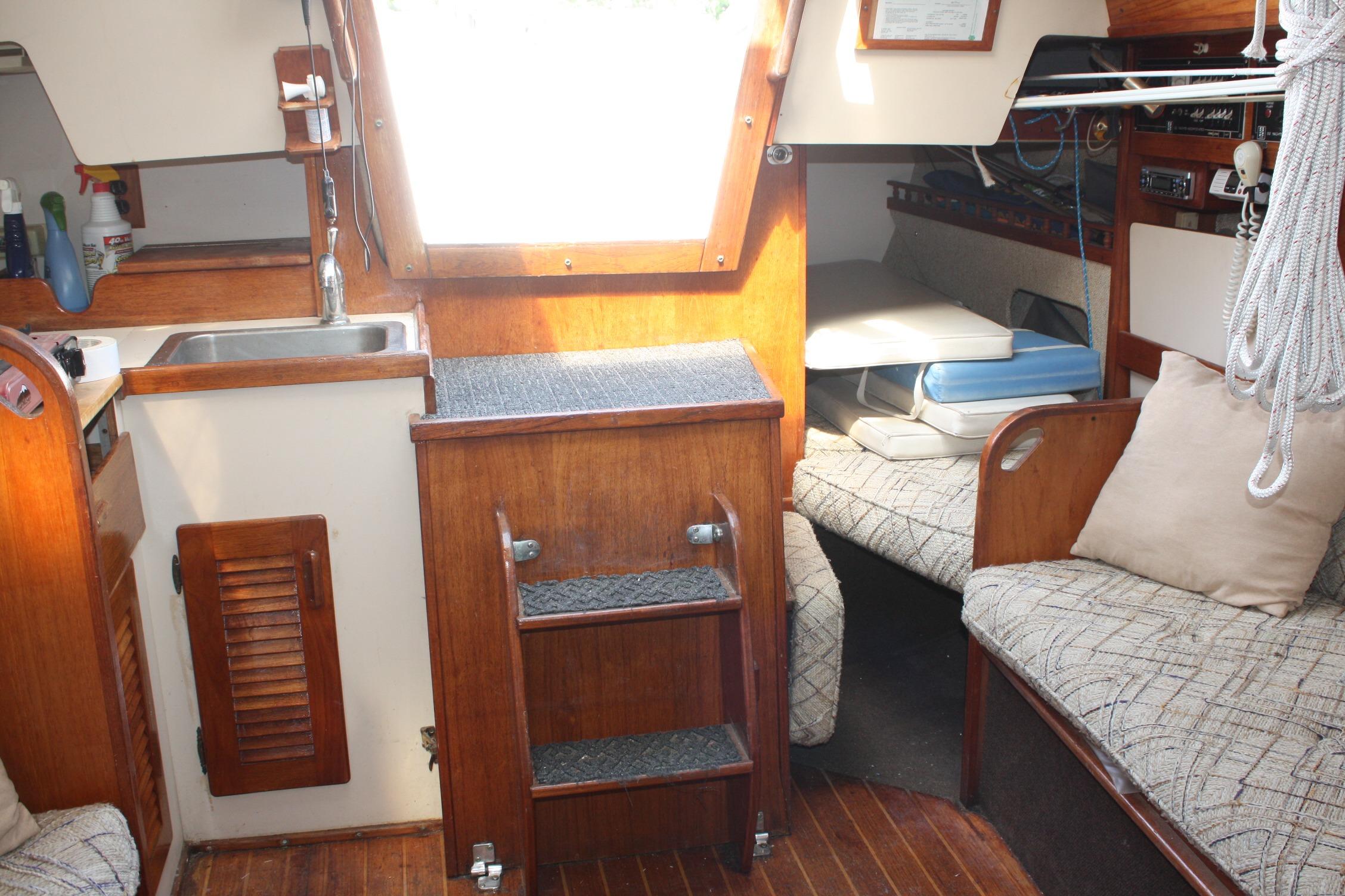 Interior of a 1981 S2 9.2A sailboat featuring a cozy cabin with wood accents.