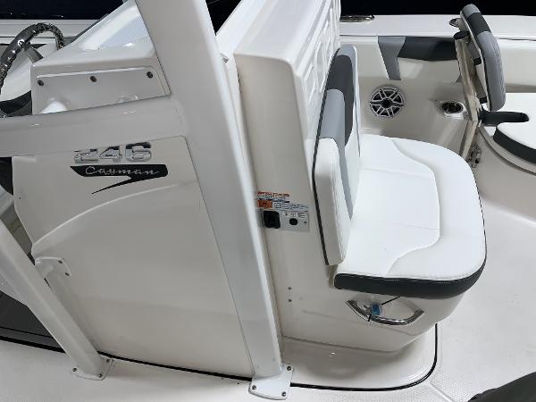 2024 Robalo 246 Cayman boat interior, featuring white seating and console.