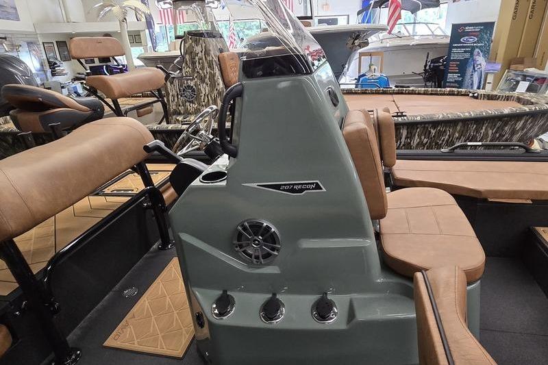 Interior view of 2026 Avid 207 Recon boat with tan seating and control panel.