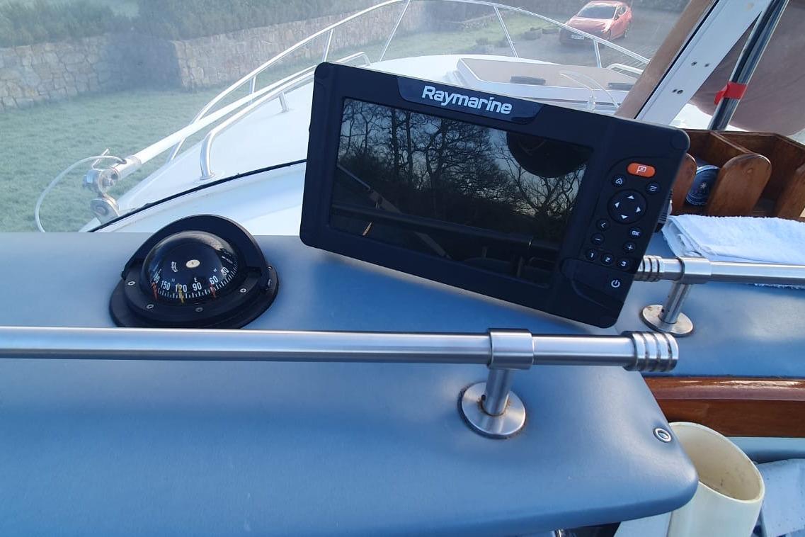 Boat dashboard with Raymarine display and compass on Fairey Spearfish MKIII, 1989 model.