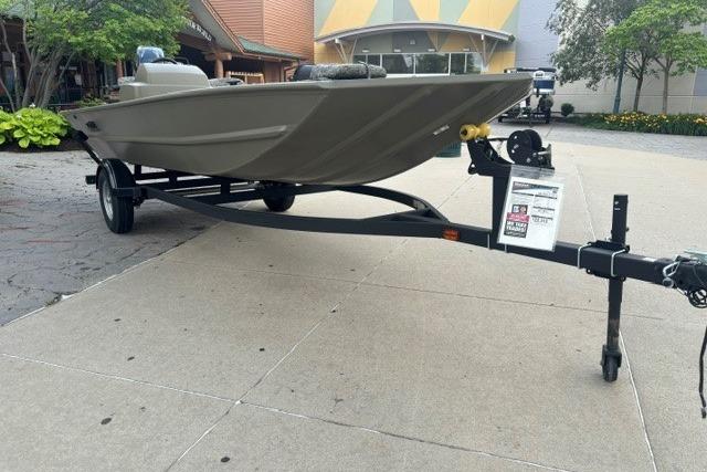 2026 Tracker Grizzly 1754 SC boat on trailer, parked outdoors.