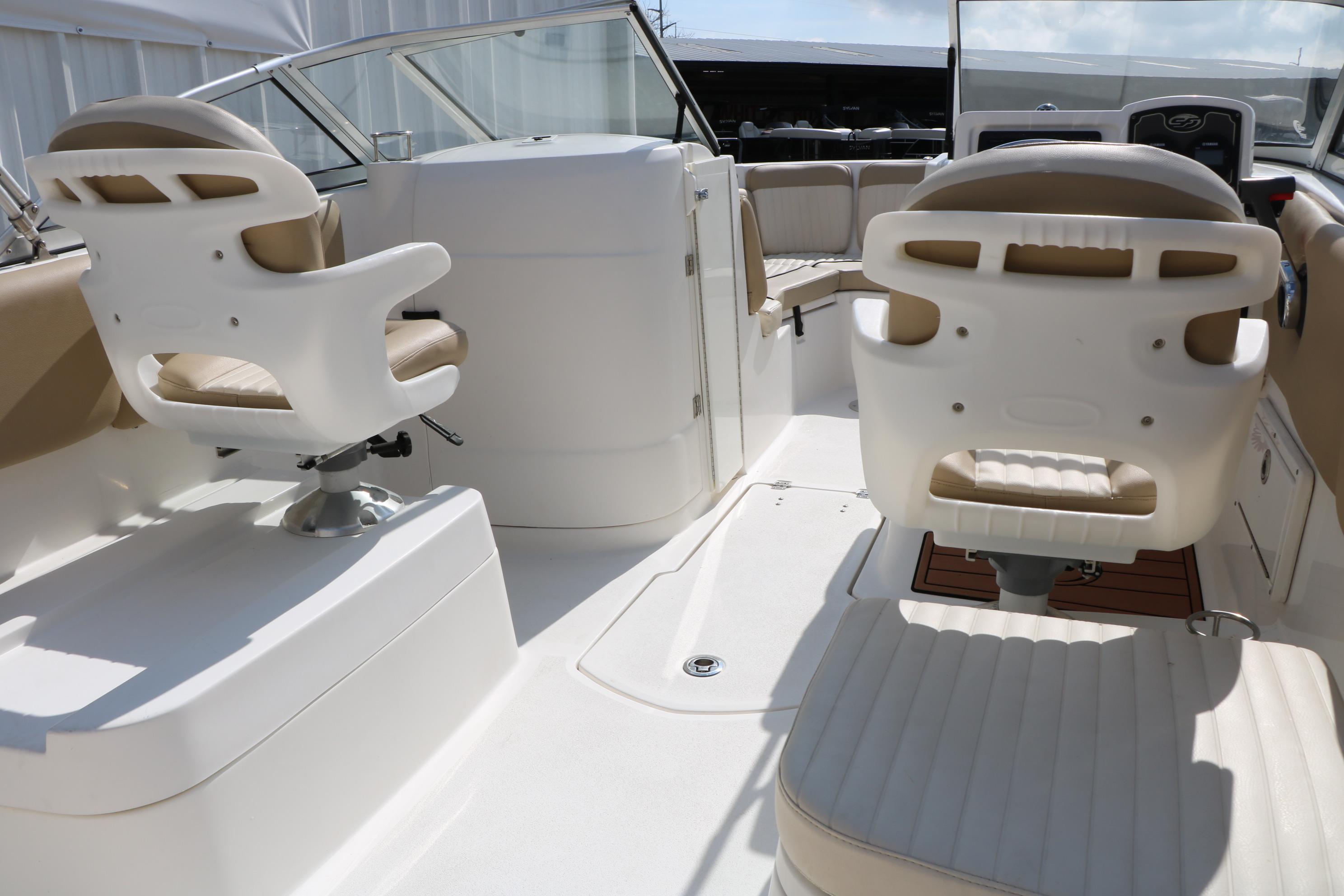 Interior view of 2017 Sea Fox 226 Traveler boat with seating and helm.